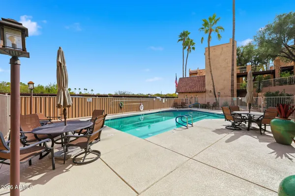a view of a swimming pool with a lounge chairs