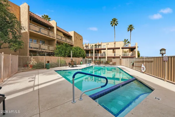 a view of a swimming pool with a patio