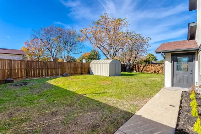 a aerial view of a house with a yard and garden