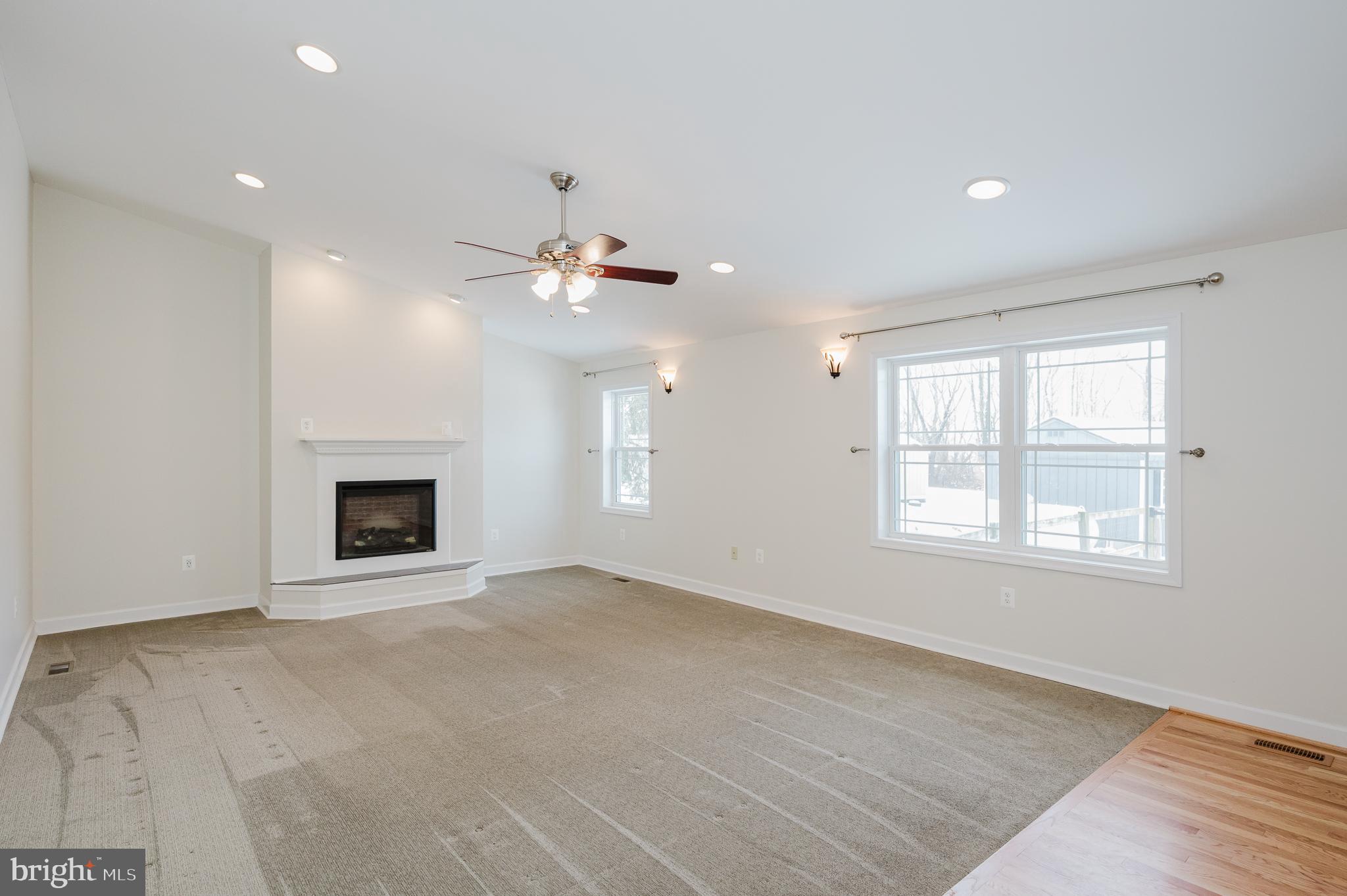 2210 Pleasantville Road Fallston, MD 21047 - Photo 13 of 56 an empty room with windows and fireplace