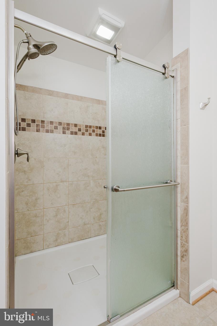 2210 Pleasantville Road Fallston, MD 21047 - Photo 26 of 56 a bathroom with a glass shower door