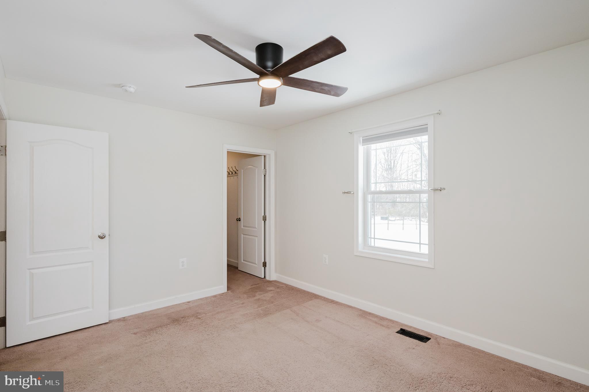 2210 Pleasantville Road Fallston, MD 21047 - Photo 28 of 56 a view of a livingroom with a ceiling fan & windows