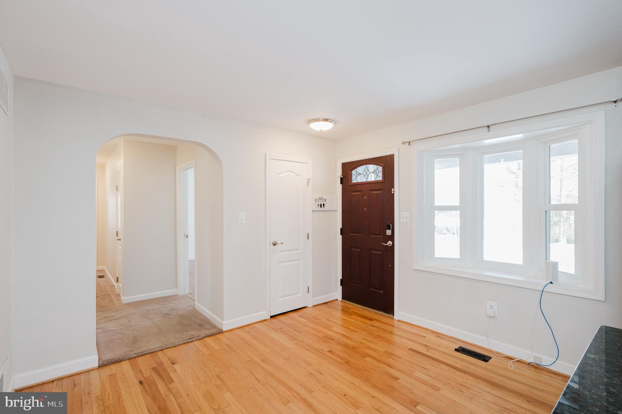 2210 Pleasantville Road Fallston, MD 21047 - Photo 3 of 56 a view of empty room with window and wooden floor