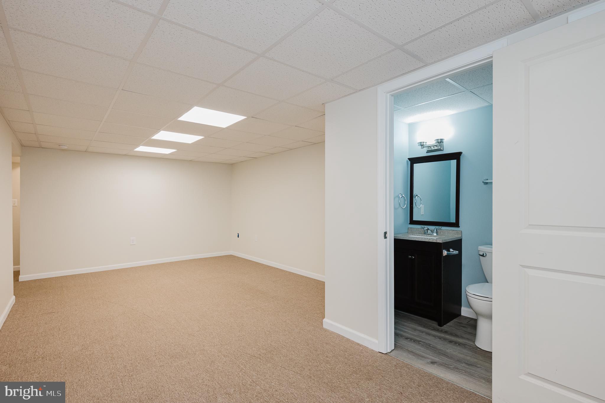 2210 Pleasantville Road Fallston, MD 21047 - Photo 39 of 56 an empty room with mirror and a bathroom