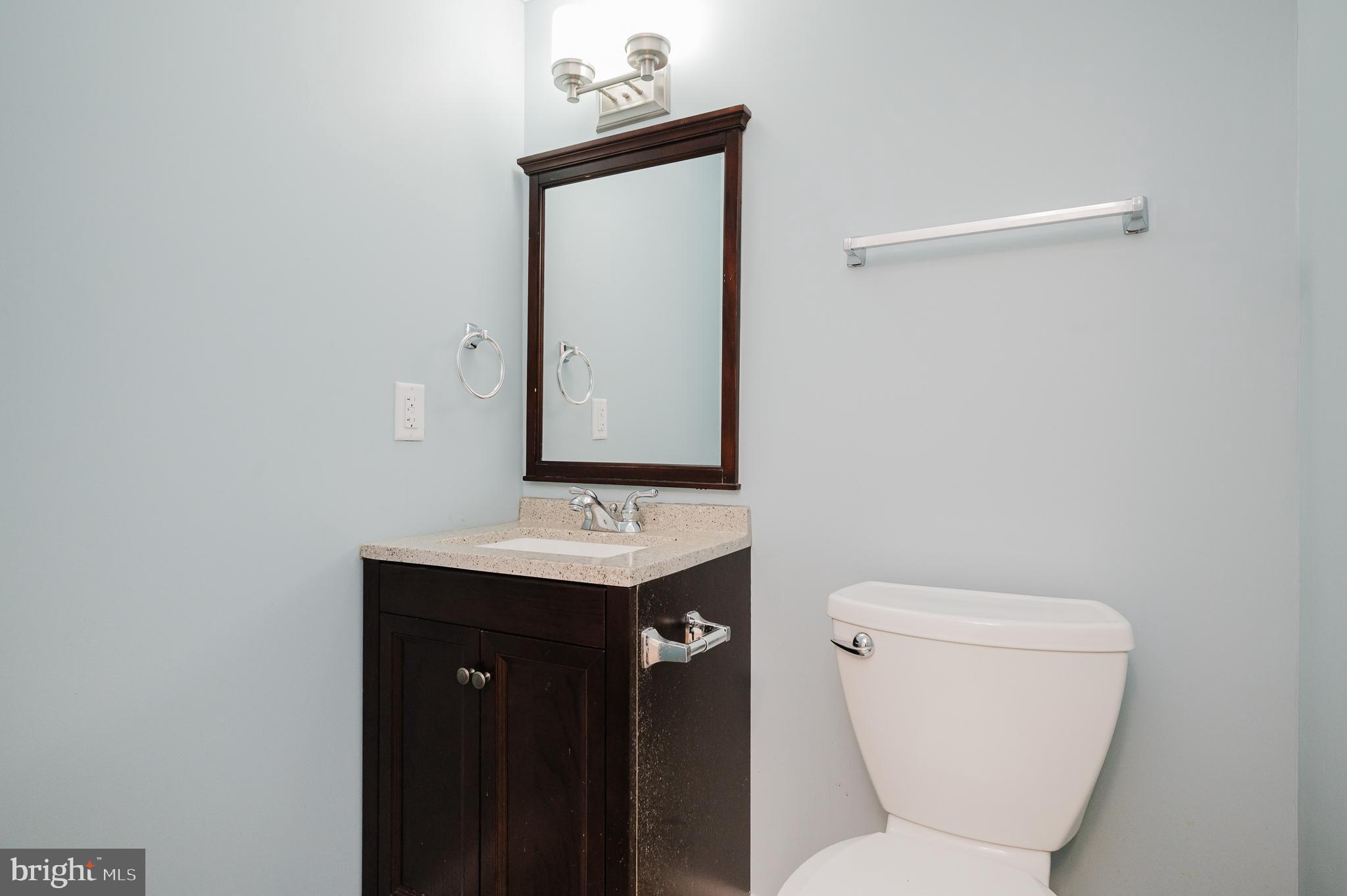 2210 Pleasantville Road Fallston, MD 21047 - Photo 40 of 56 a bathroom with a toilet a sink and mirror