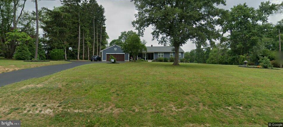 2210 Pleasantville Road Fallston, MD 21047 - Photo 53 of 56 a view of a house with a big yard and large trees