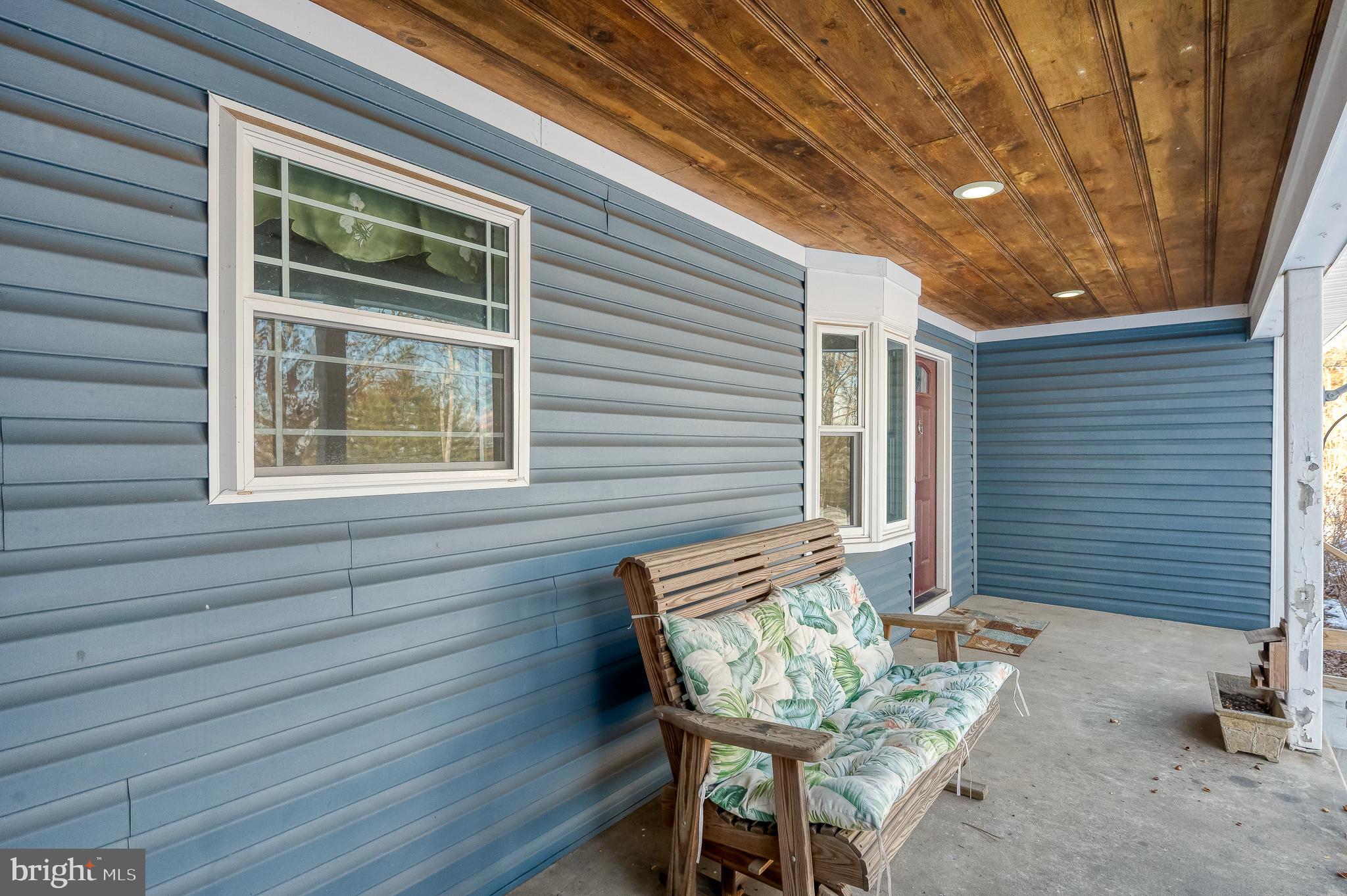 2210 Pleasantville Road Fallston, MD 21047 - Photo 55 of 56 a view of a deck with table and chairs with wooden floor and fence