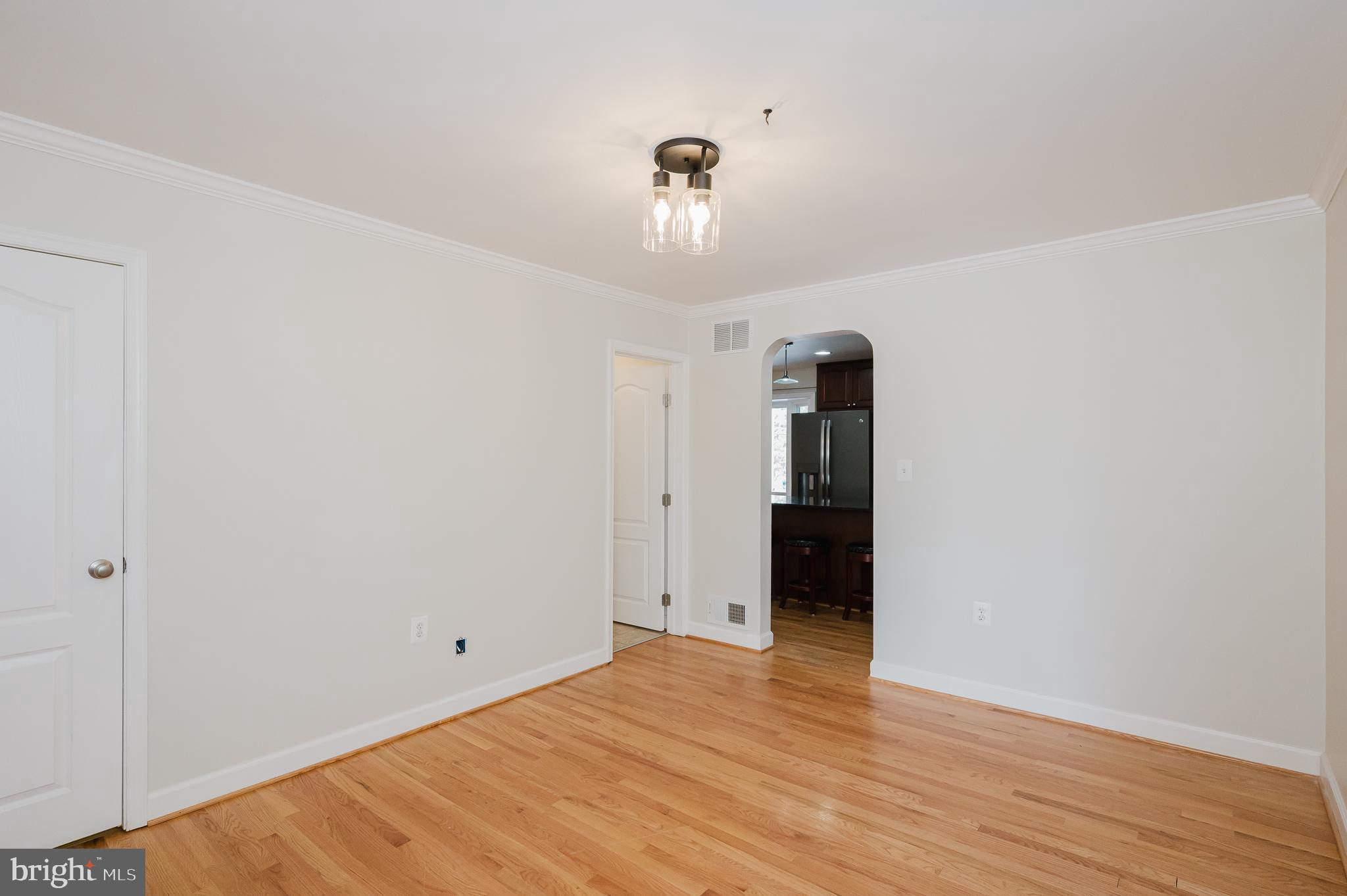 2210 Pleasantville Road Fallston, MD 21047 - Photo 9 of 56 a view of an empty room with wooden floor