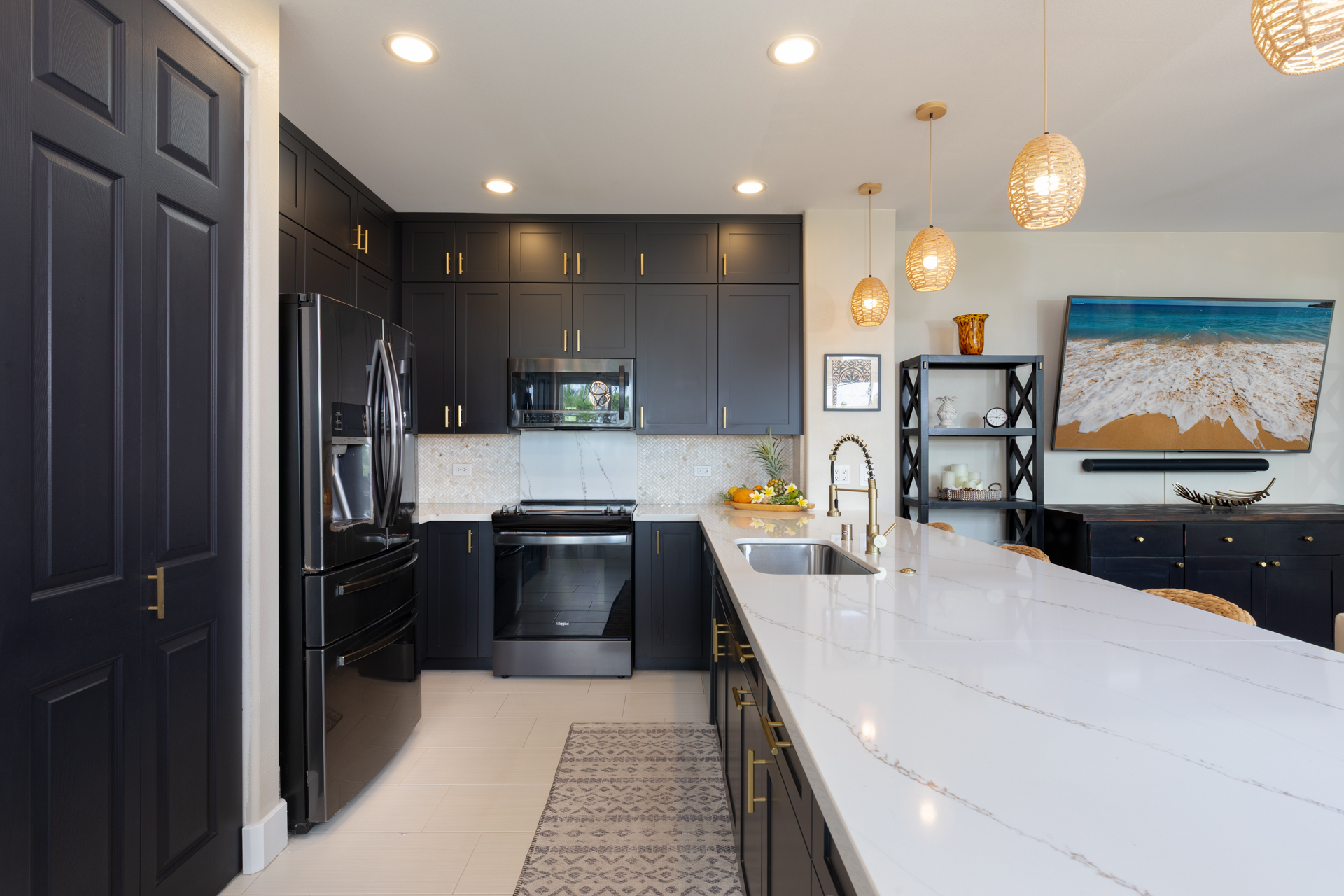 75-6009 Alii Drive, Unit A4 Kailua-Kona, HI 96740 - Photo 13 of 27 a kitchen with a refrigerator and a stove top oven