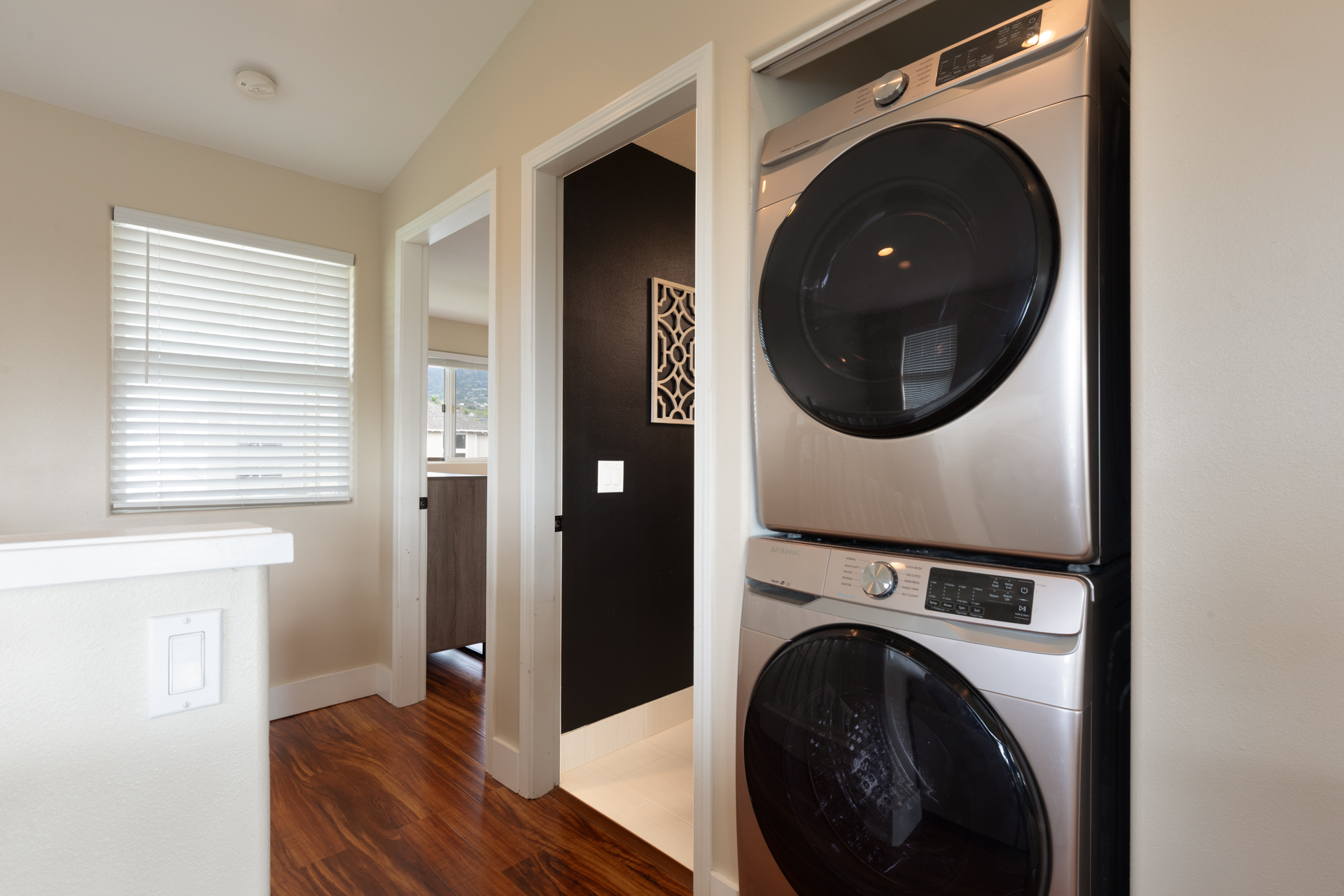 75-6009 Alii Drive, Unit A4 Kailua-Kona, HI 96740 - Photo 21 of 27 a room with a washer and dryer