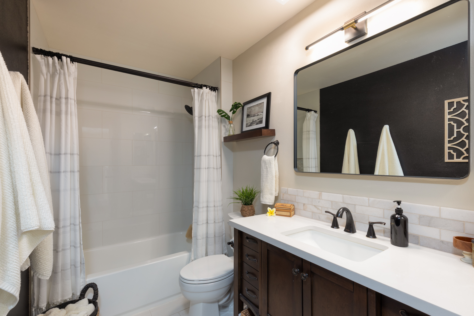 75-6009 Alii Drive, Unit A4 Kailua-Kona, HI 96740 - Photo 22 of 27 a bathroom with a granite countertop sink toilet and shower