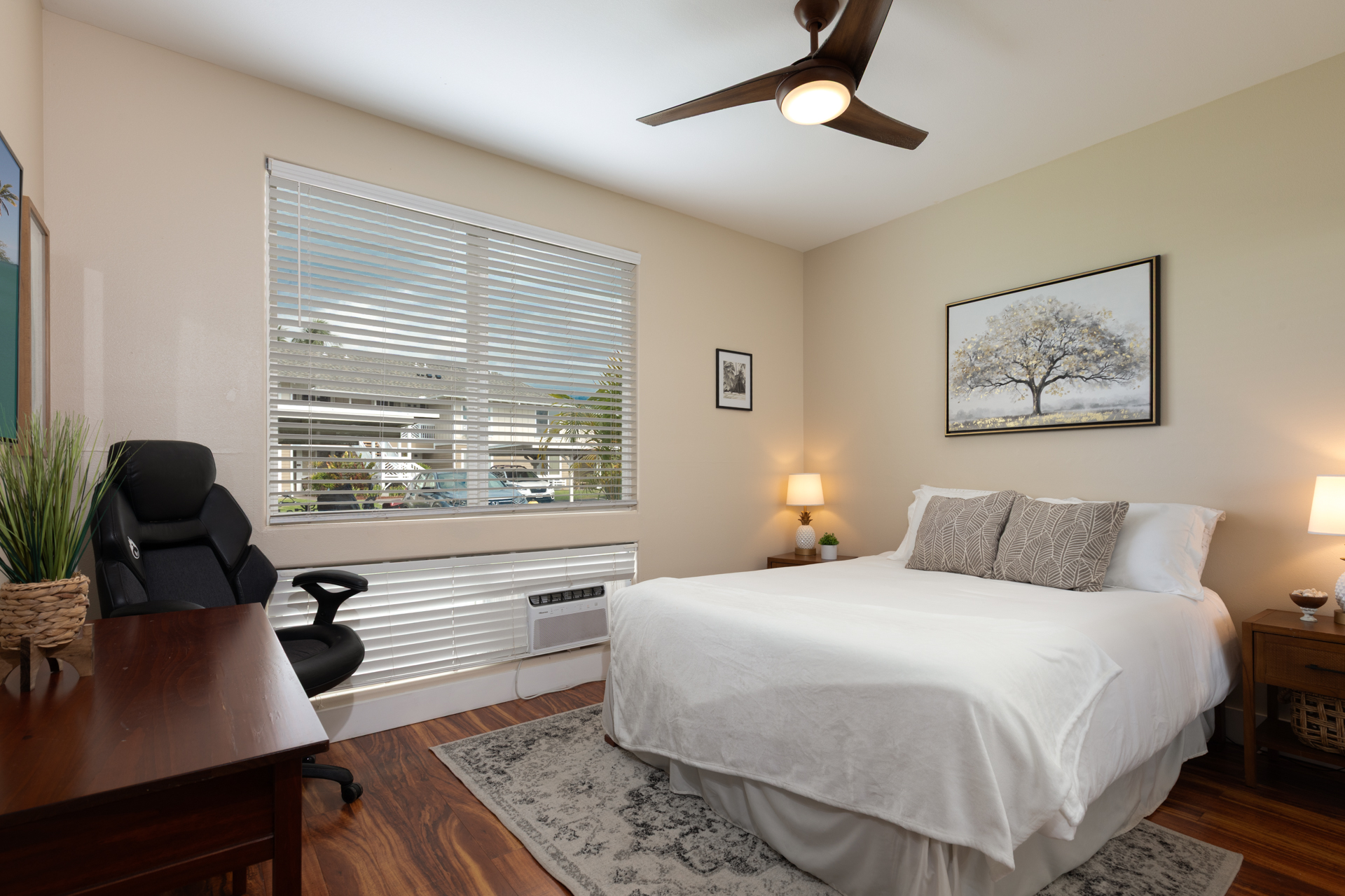 75-6009 Alii Drive, Unit A4 Kailua-Kona, HI 96740 - Photo 23 of 27 a bedroom with a bed and a large window