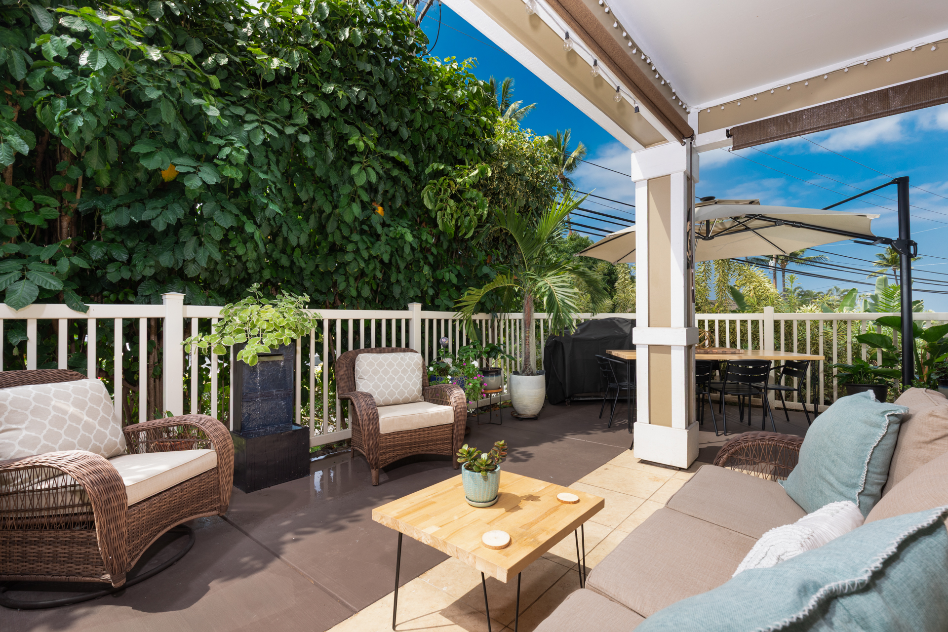 75-6009 Alii Drive, Unit A4 Kailua-Kona, HI 96740 - Photo 4 of 27 a outdoor living space with furniture and garden view