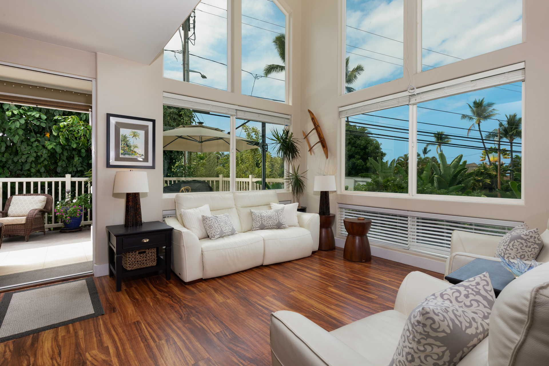 75-6009 Alii Drive, Unit A4 Kailua-Kona, HI 96740 - Photo 5 of 27 a living room with furniture and a large window
