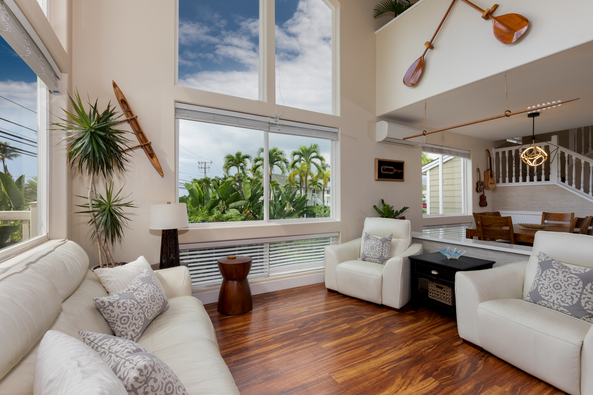 75-6009 Alii Drive, Unit A4 Kailua-Kona, HI 96740 - Photo 6 of 27 a living room with furniture and a large window