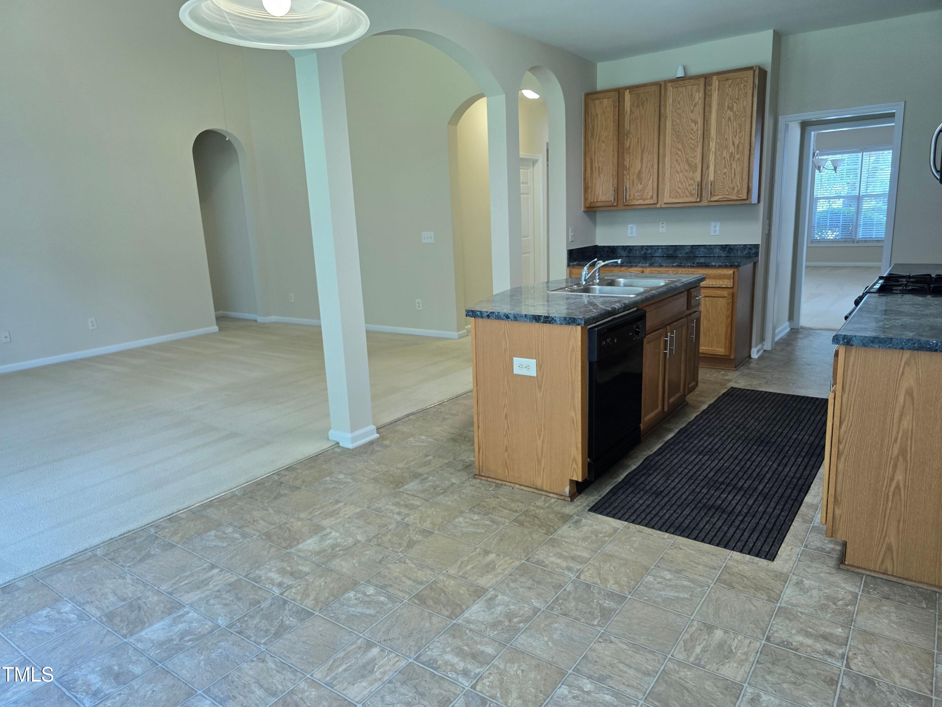 2330 Lazy River Drive Raleigh, NC 27610 - Photo 17 of 31 a kitchen with stainless steel appliances a refrigerator and a stove