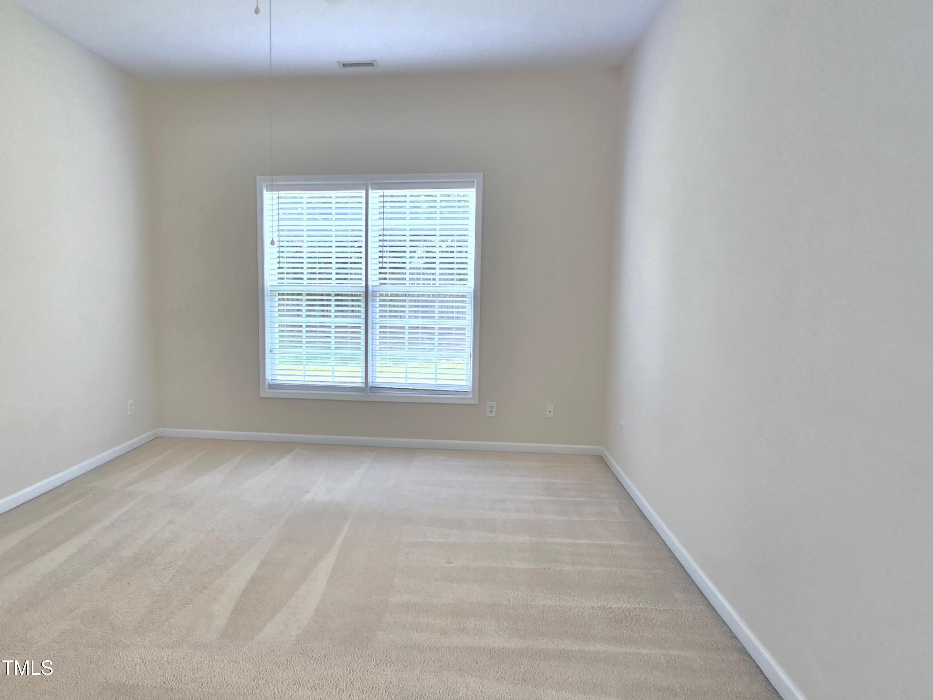 2330 Lazy River Drive Raleigh, NC 27610 - Photo 20 of 31 an empty room with a window
