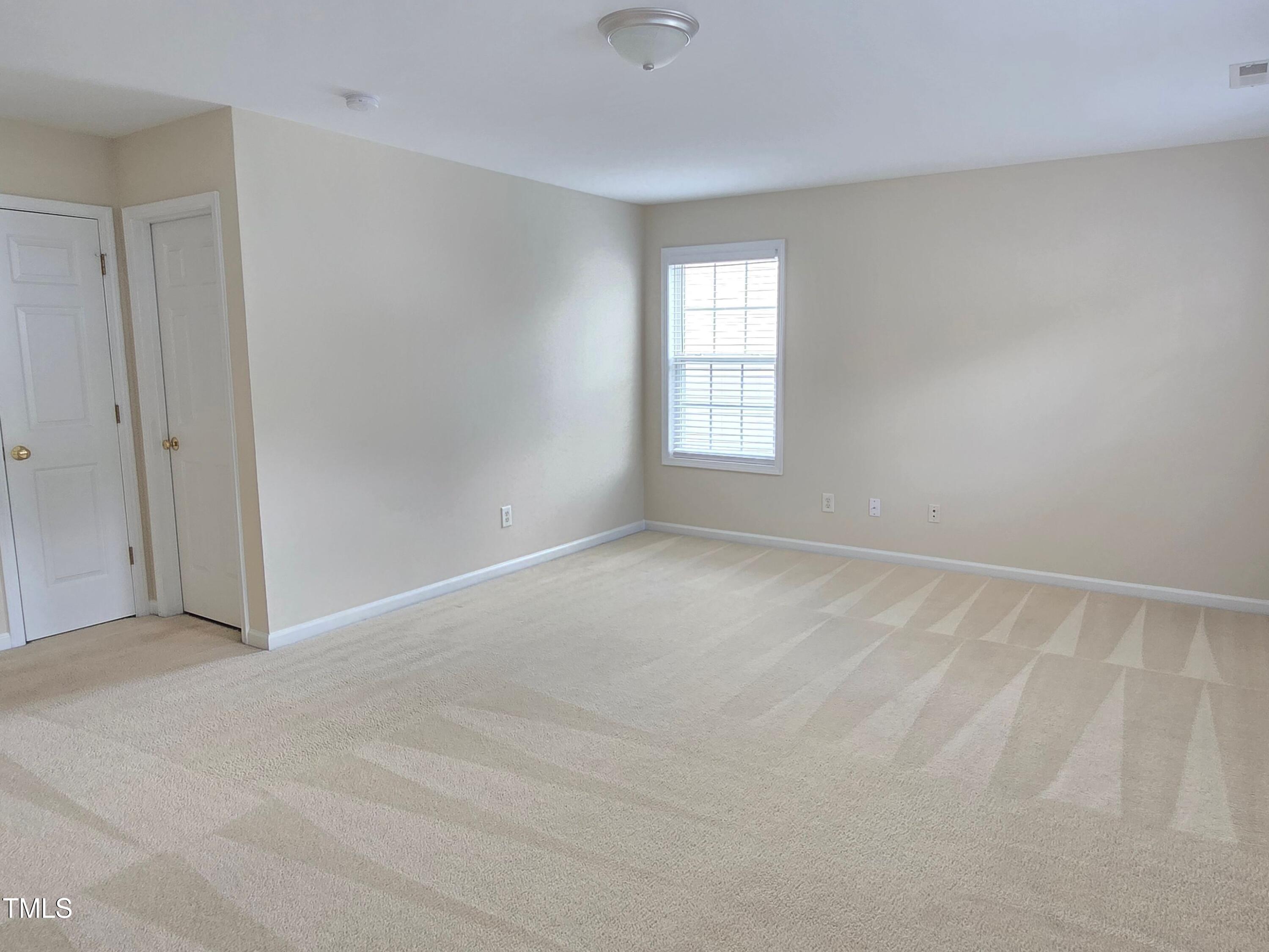 2330 Lazy River Drive Raleigh, NC 27610 - Photo 25 of 31 a view of an empty room with a window