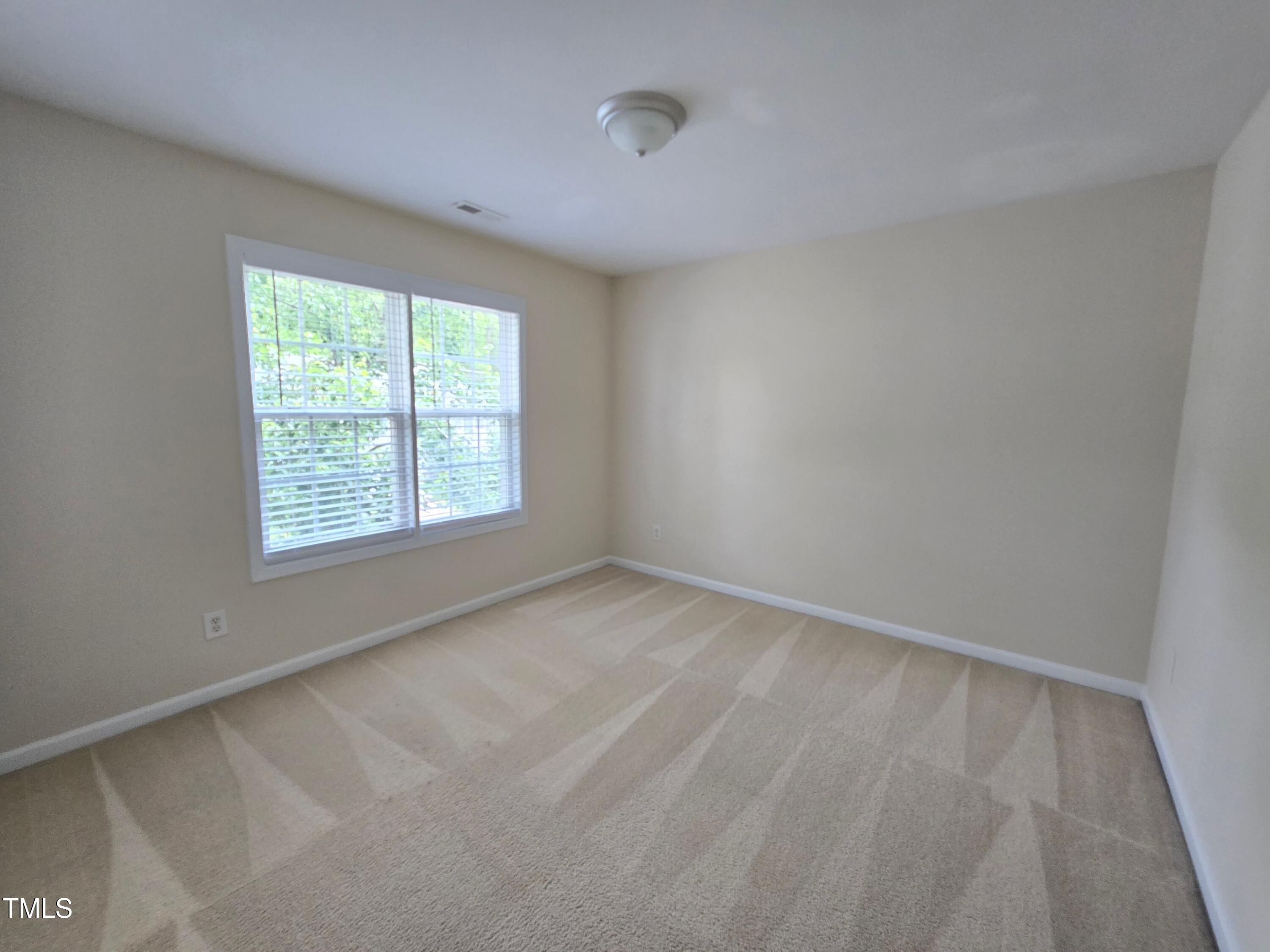 2330 Lazy River Drive Raleigh, NC 27610 - Photo 30 of 31 an empty room with a window
