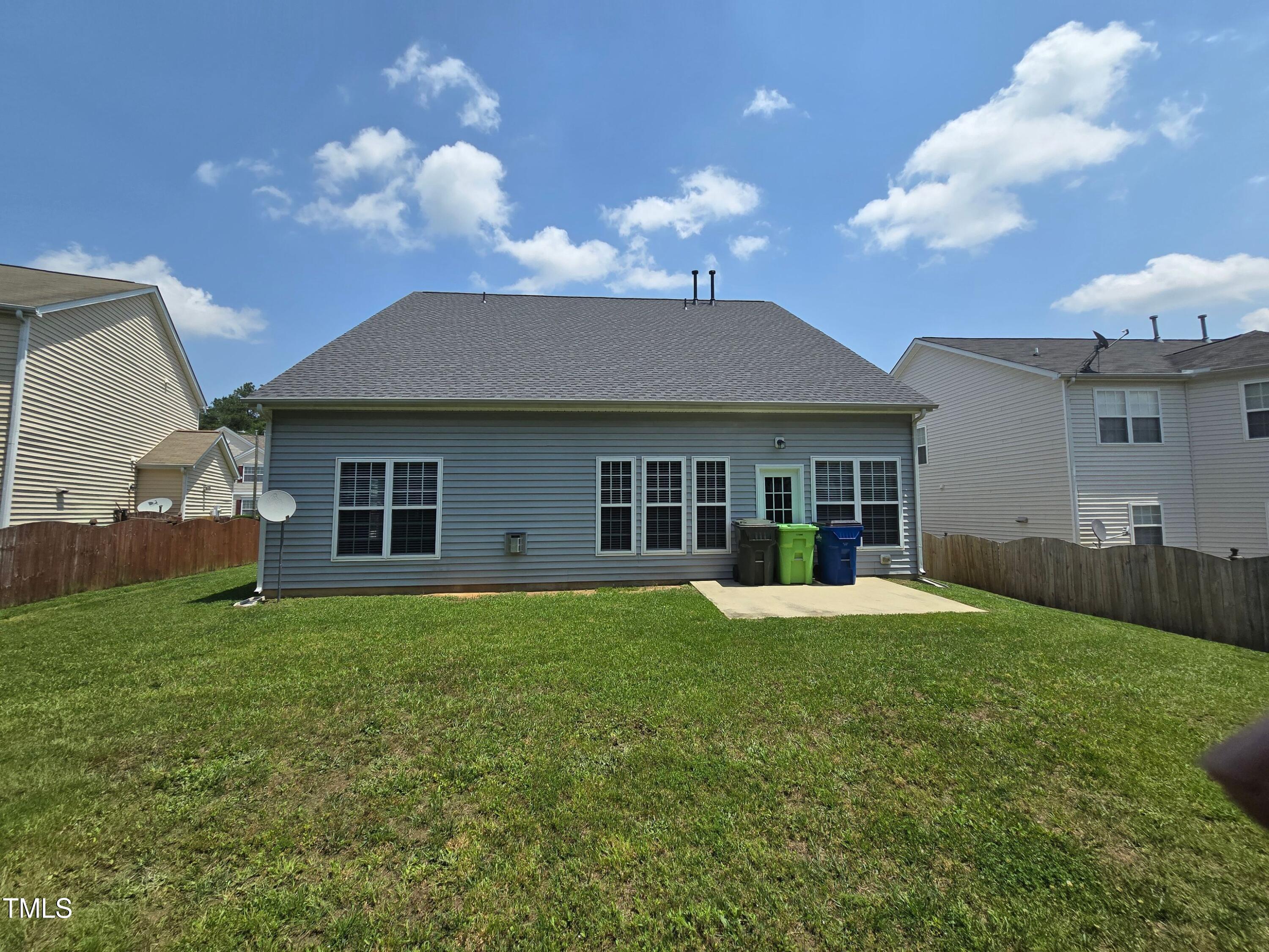 2330 Lazy River Drive Raleigh, NC 27610 - Photo 3 of 31 a front view of a house with a yard and garage