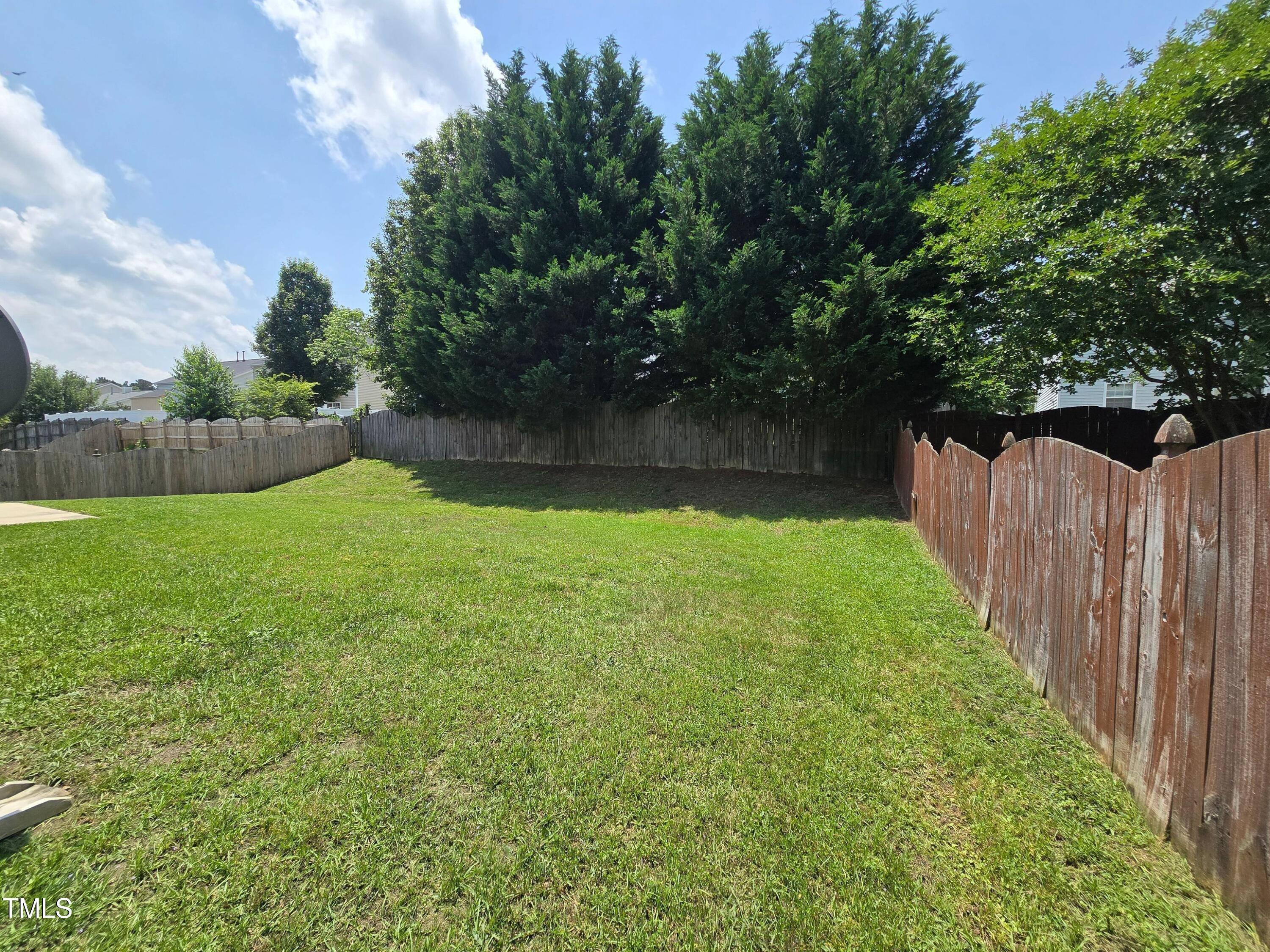 2330 Lazy River Drive Raleigh, NC 27610 - Photo 4 of 31 a view of a backyard with a small cabin