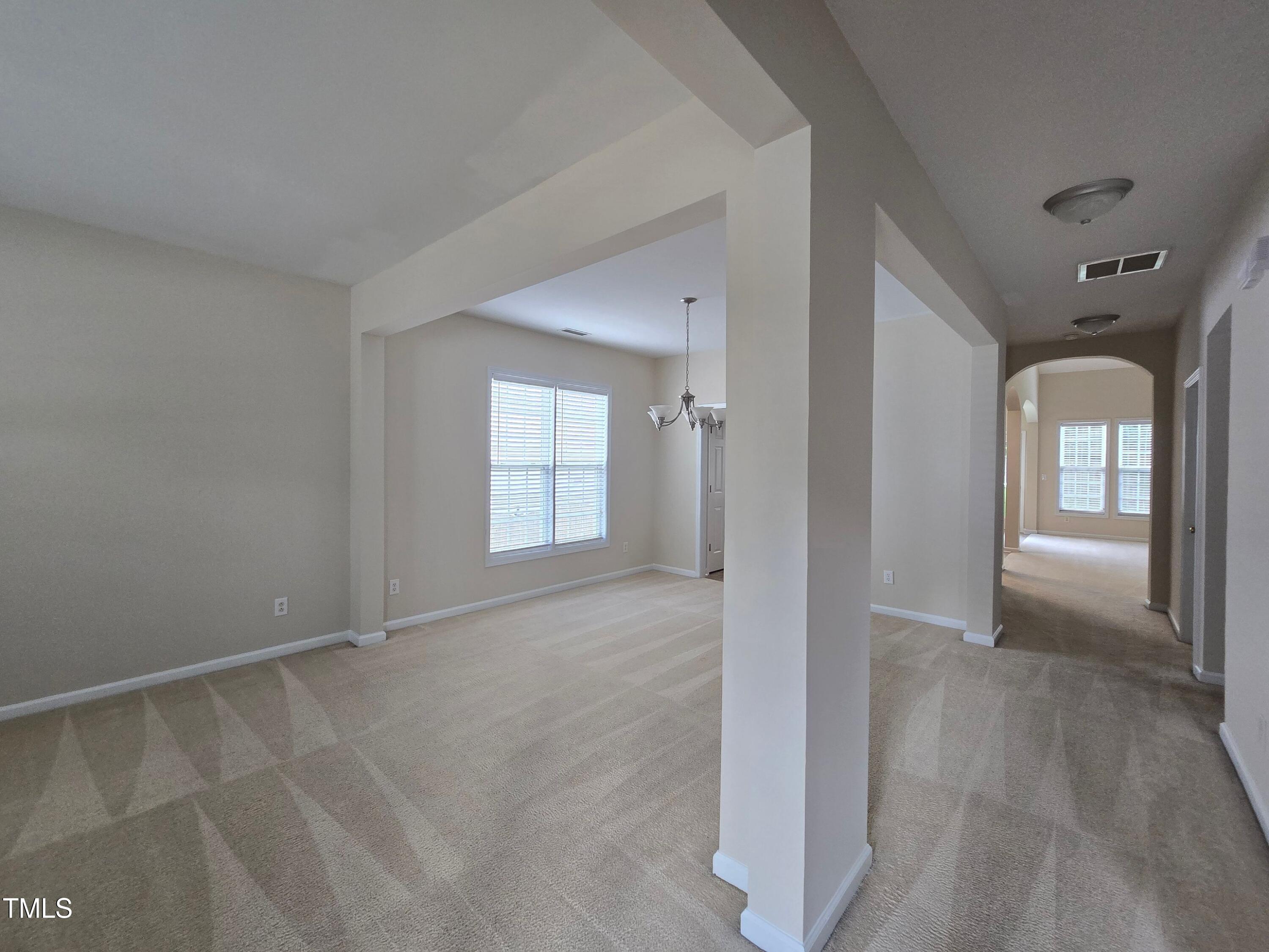 2330 Lazy River Drive Raleigh, NC 27610 - Photo 6 of 31 wooden floor and window in a room