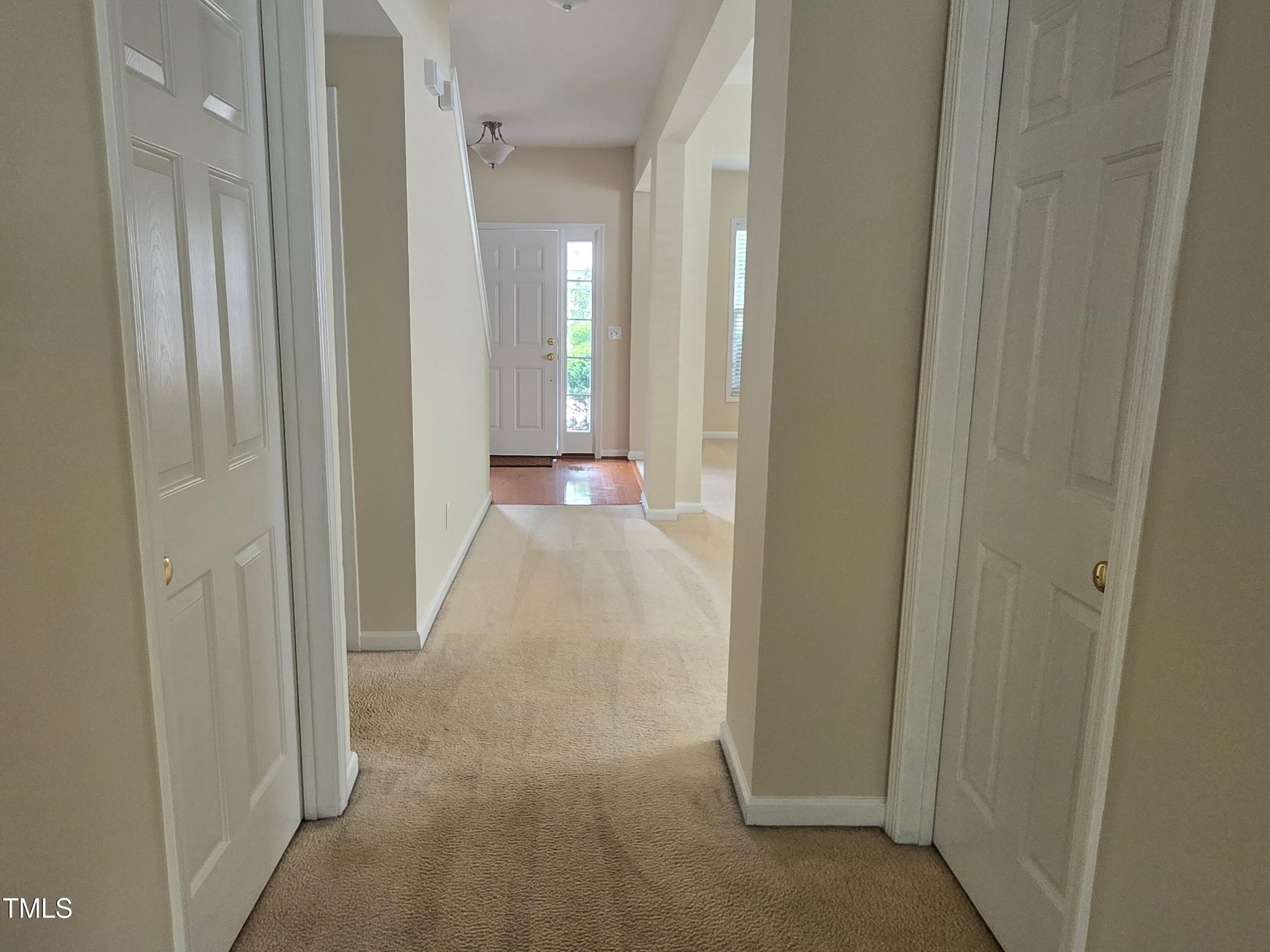 2330 Lazy River Drive Raleigh, NC 27610 - Photo 7 of 31 a view of a hallway with wooden floor
