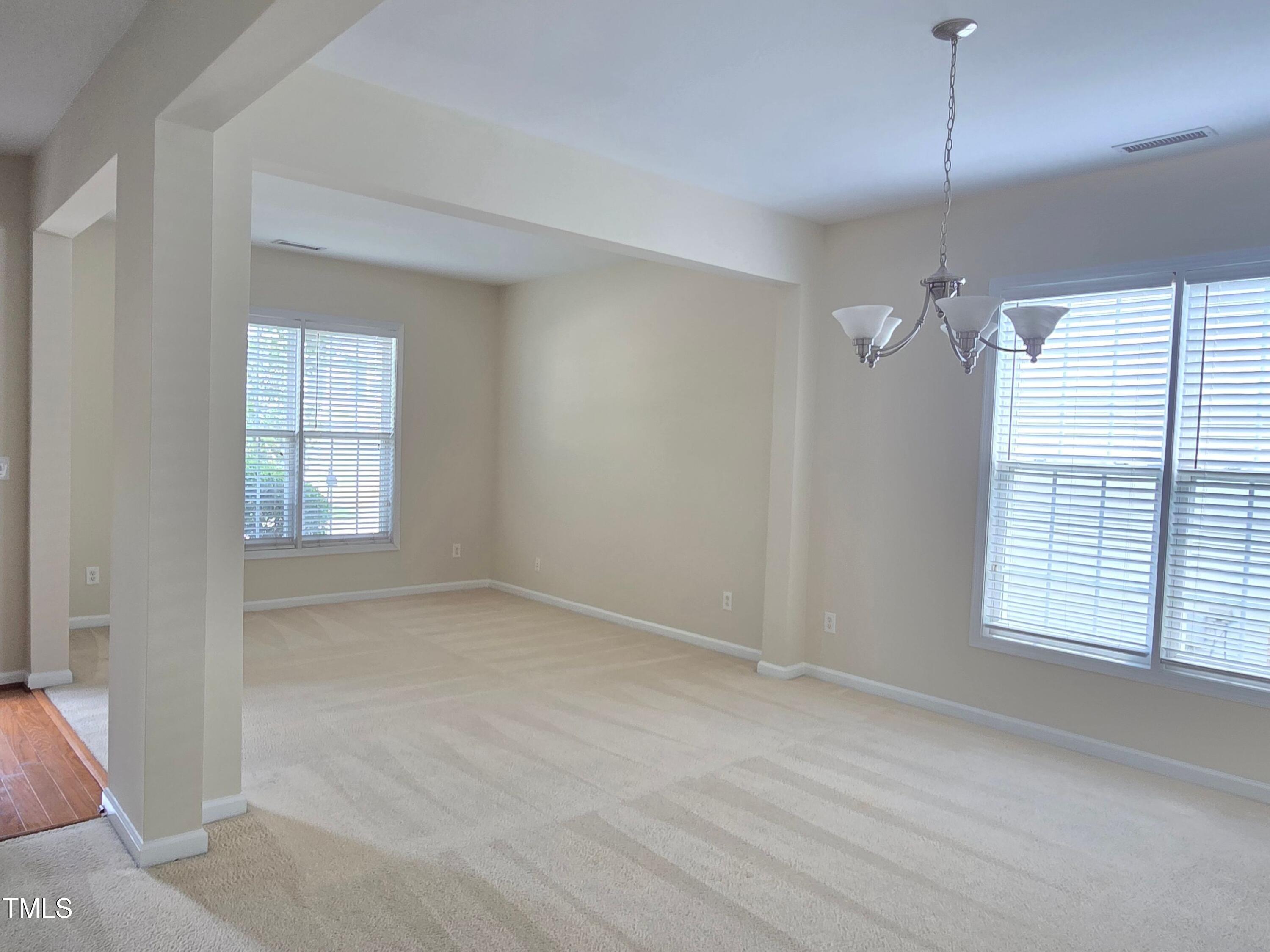 2330 Lazy River Drive Raleigh, NC 27610 - Photo 8 of 31 an empty room with windows and closet