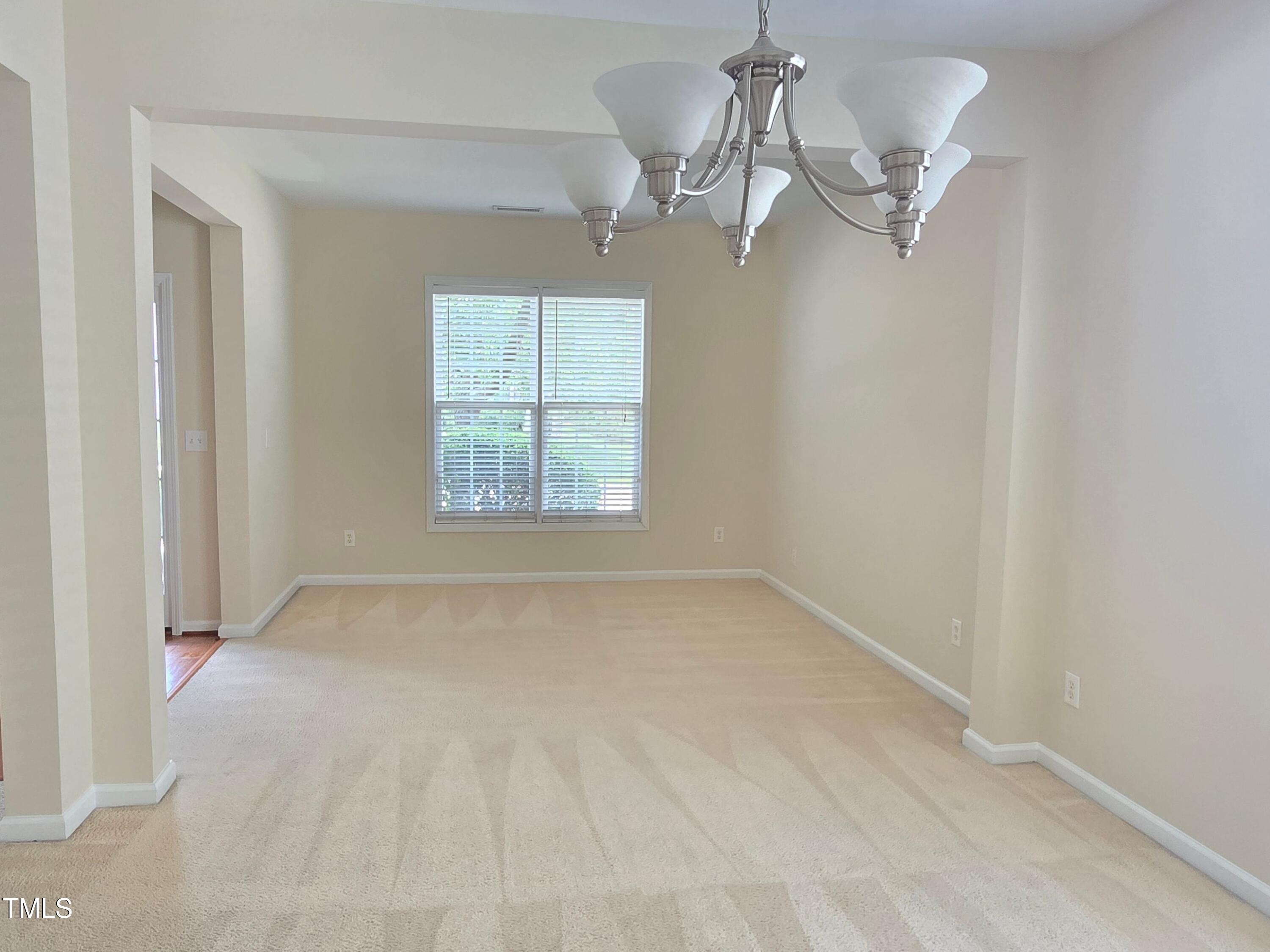 2330 Lazy River Drive Raleigh, NC 27610 - Photo 9 of 31 an empty room with a window