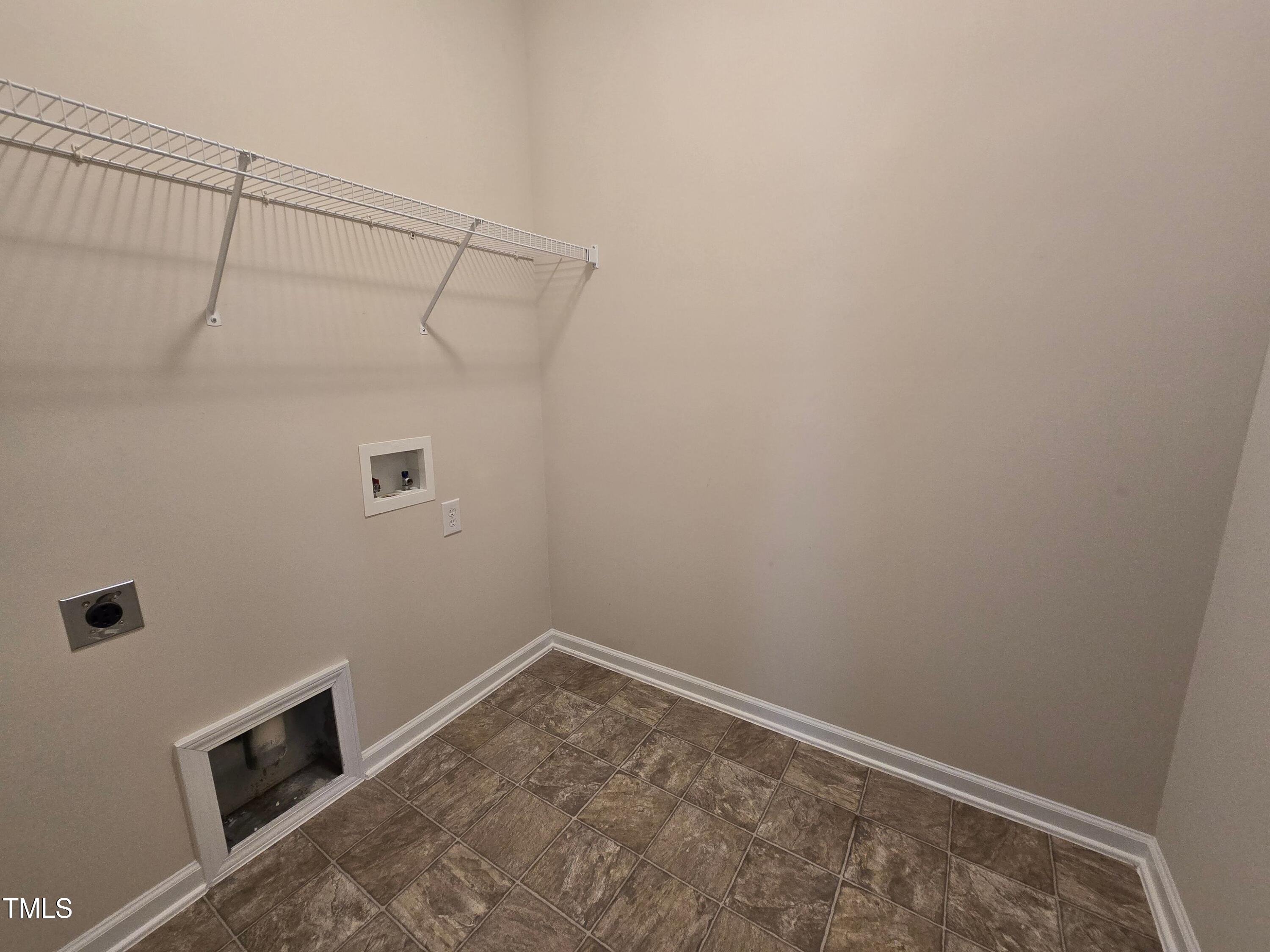 2330 Lazy River Drive Raleigh, NC 27610 - Photo 10 of 31 a view of a room with racks on the wall