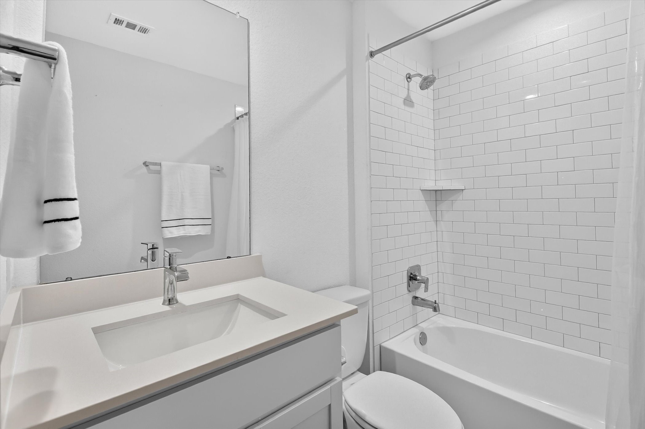 7907 Sleek Flock Lane Rosharon, TX 77583 - Photo 25 of 28 Conveniently positioned with the secondary bedrooms, the full bath keeps that side of the home functional while giving the primary suite its own separate space.
