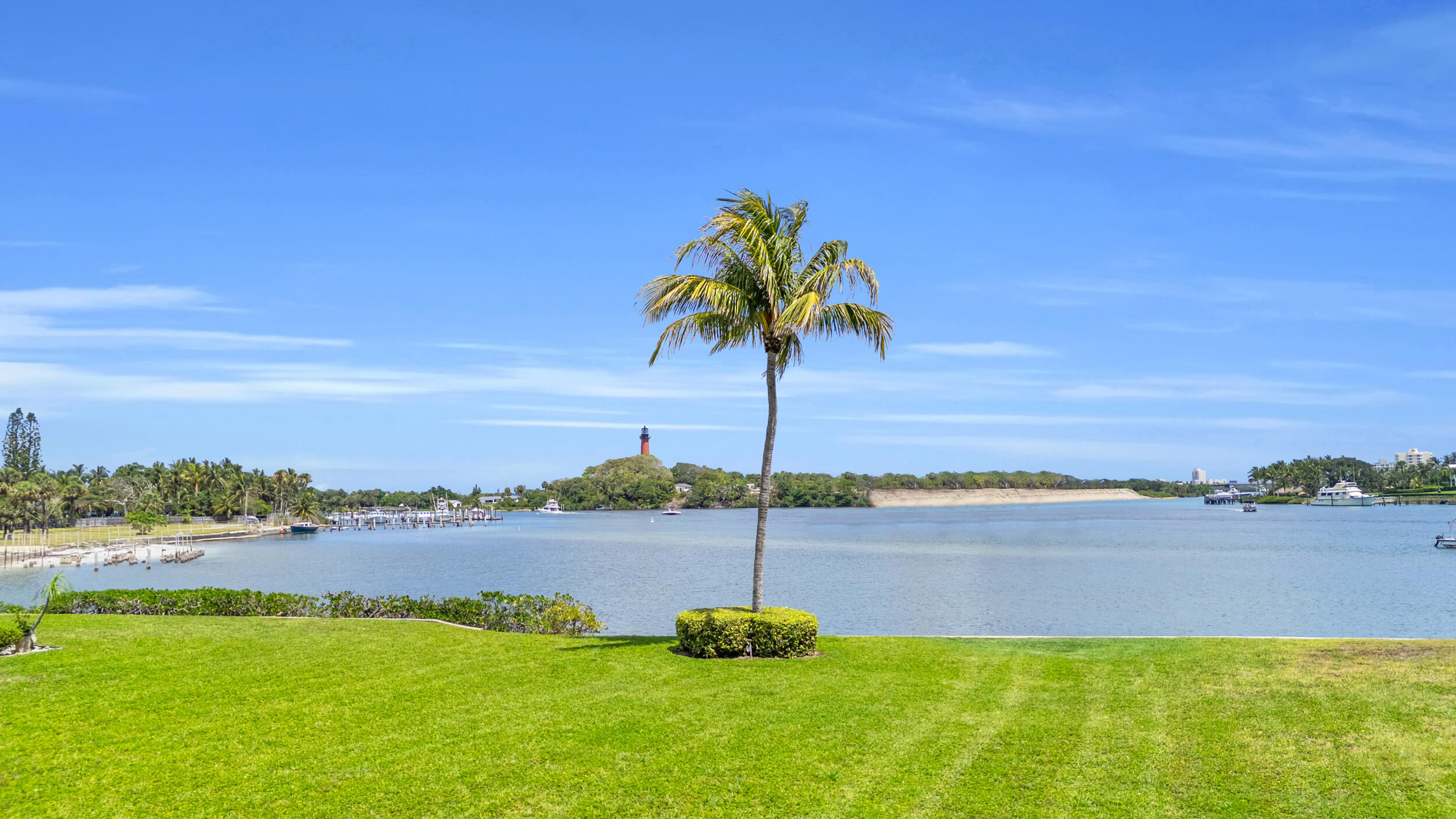 755 Saturn Street, Unit G101 Jupiter, FL 33477 - Photo 16 of 31 a view of a lake with a beach