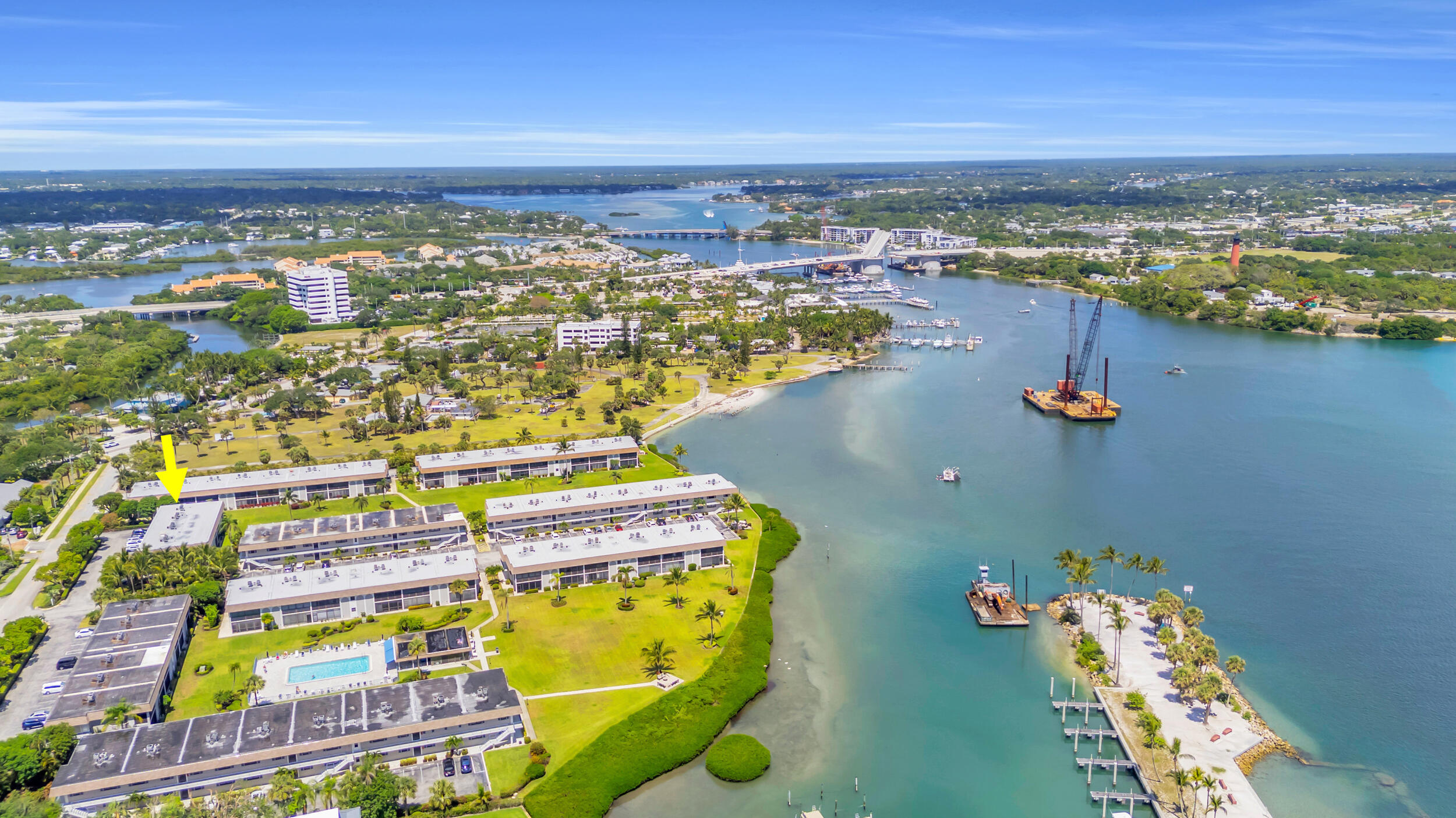 755 Saturn Street, Unit G101 Jupiter, FL 33477 - Photo 17 of 31 an aerial view of residential building and lake