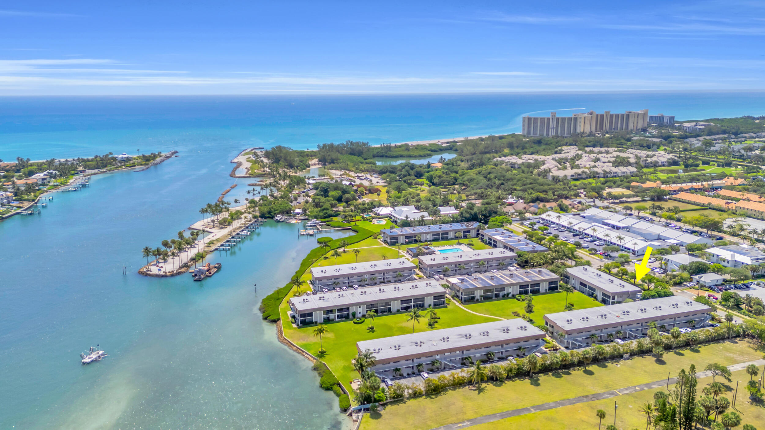 755 Saturn Street, Unit G101 Jupiter, FL 33477 - Photo 22 of 31 an aerial view of residential houses with outdoor space and ocean view