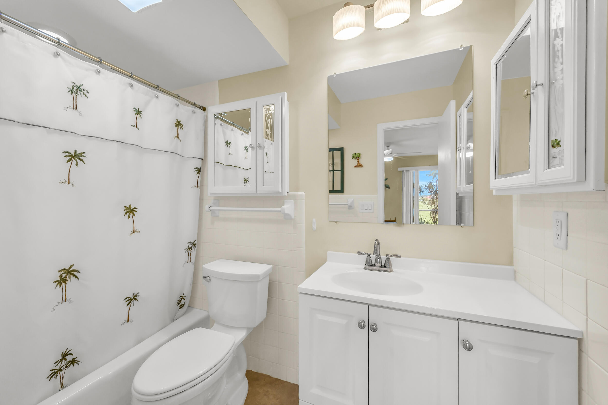 755 Saturn Street, Unit G101 Jupiter, FL 33477 - Photo 27 of 31 a bathroom with a sink a toilet and shower