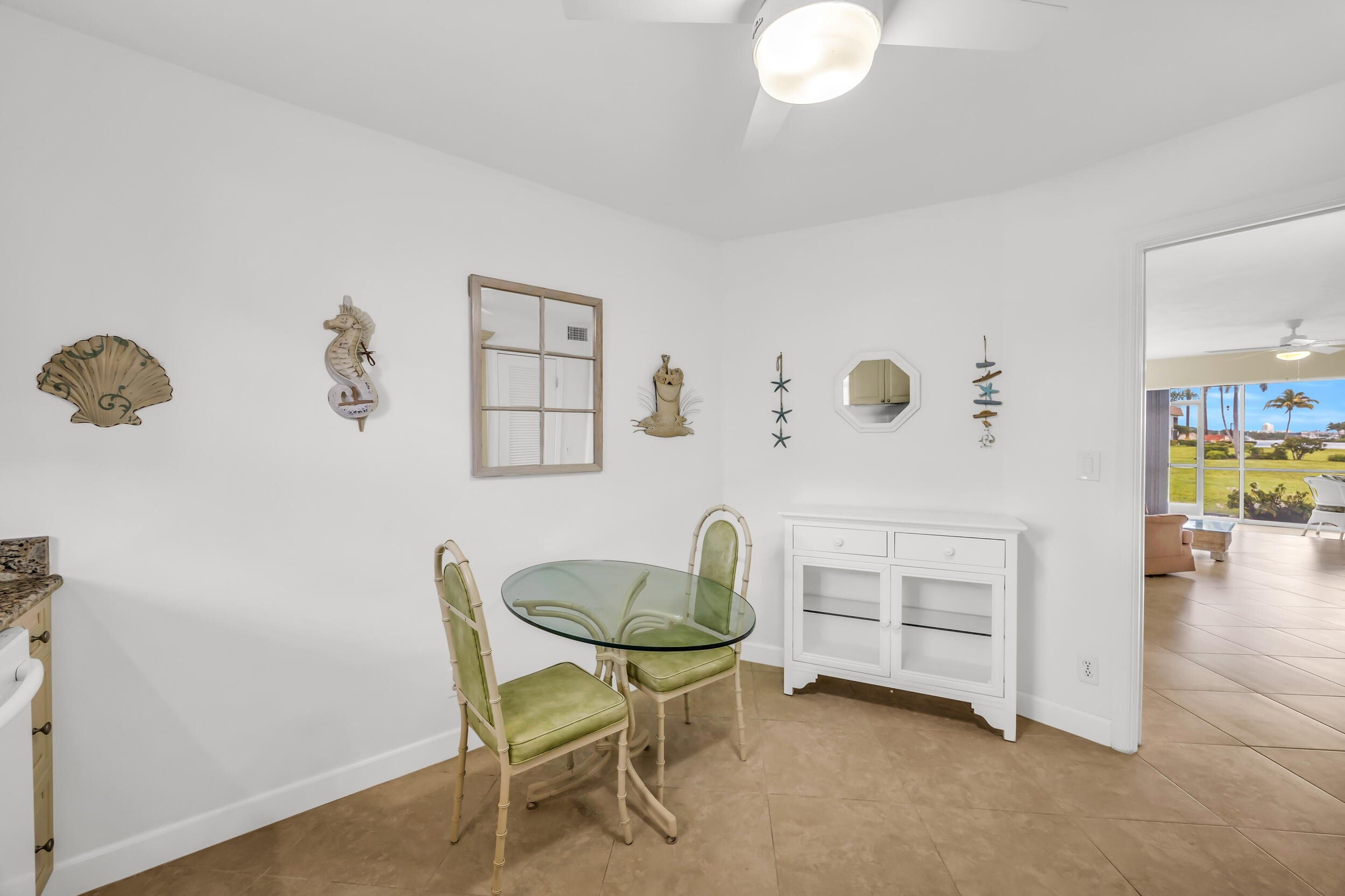 755 Saturn Street, Unit G101 Jupiter, FL 33477 - Photo 7 of 31 a dining room with furniture and wooden floor