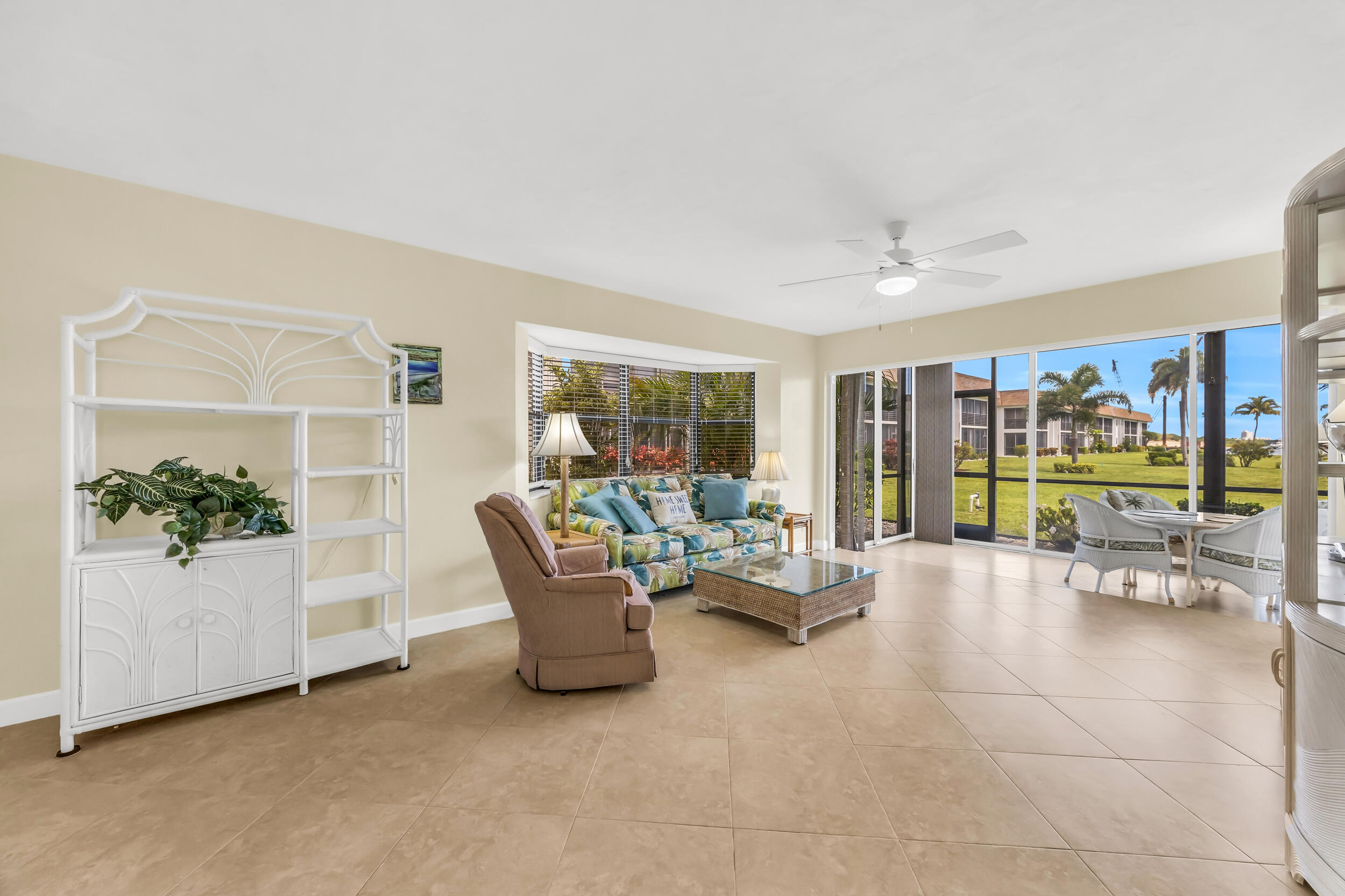 755 Saturn Street, Unit G101 Jupiter, FL 33477 - Photo 8 of 31 a living room with furniture and a potted plant