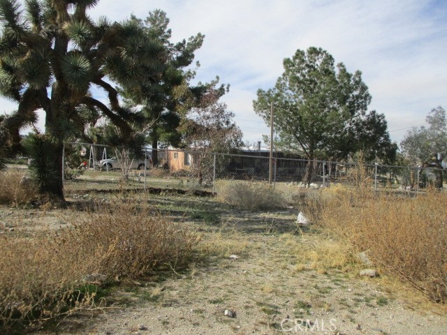 10614 Desert View Road Pinon Hills, CA 92372 - Photo 1 of 1 a view of a yard with a house