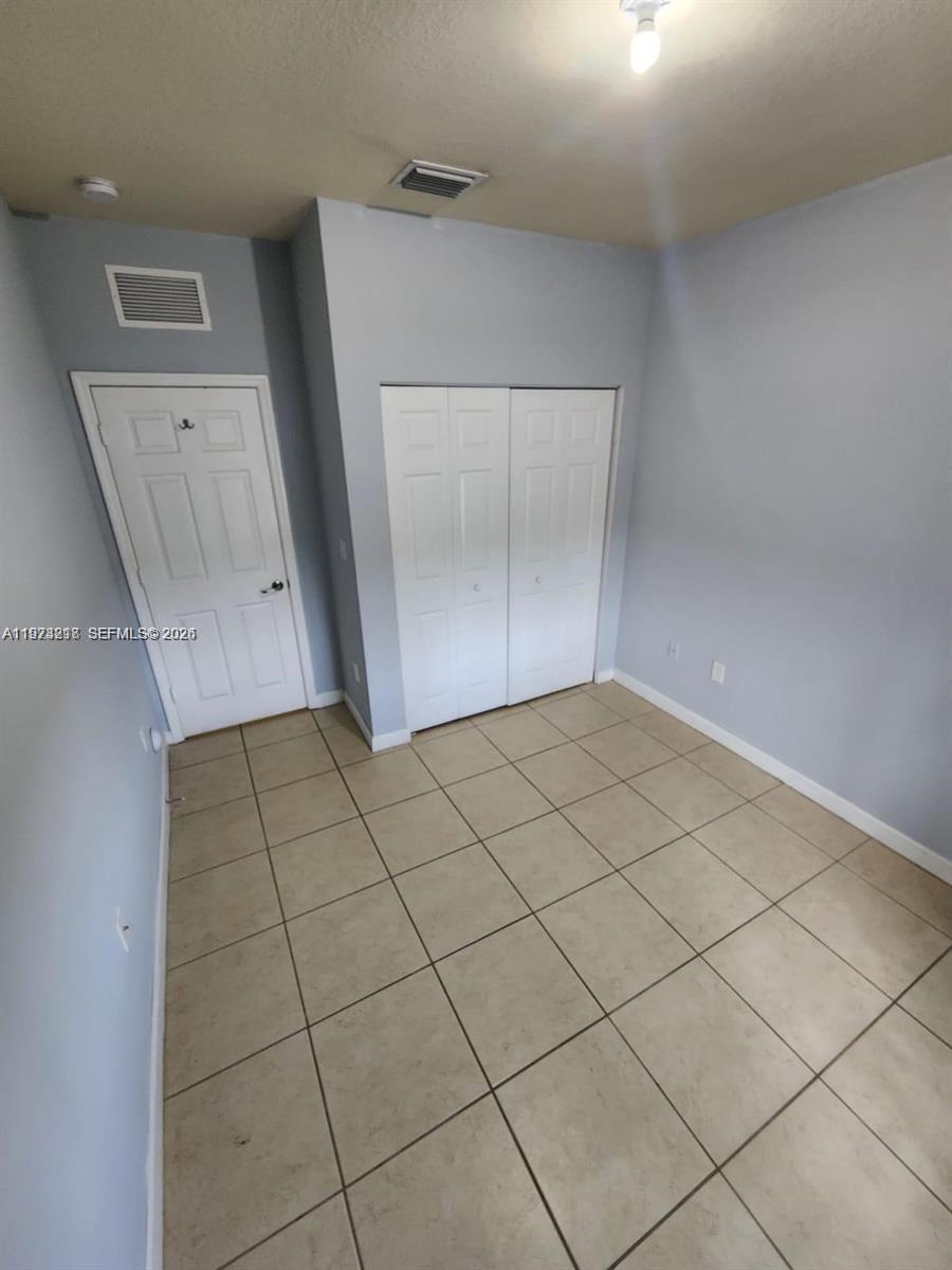 17005 Southwest 96th Street, Unit MAIN Miami, FL 33196 - Photo 17 of 19 a view of empty room