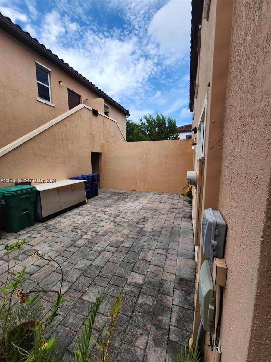 17005 Southwest 96th Street, Unit MAIN Miami, FL 33196 - Photo 19 of 19 a view of a backyard
