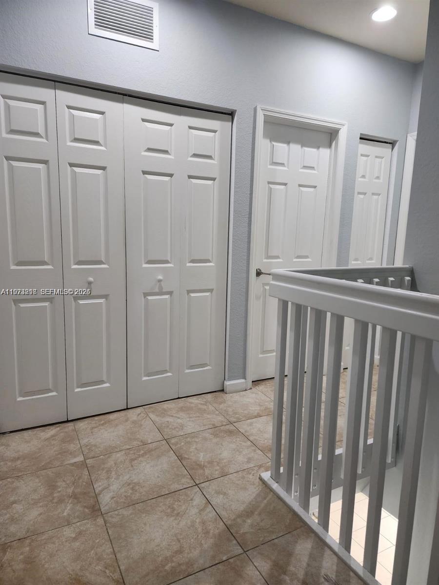 17005 Southwest 96th Street, Unit MAIN Miami, FL 33196 - Photo 10 of 19 a view of a livingroom with wooden floor