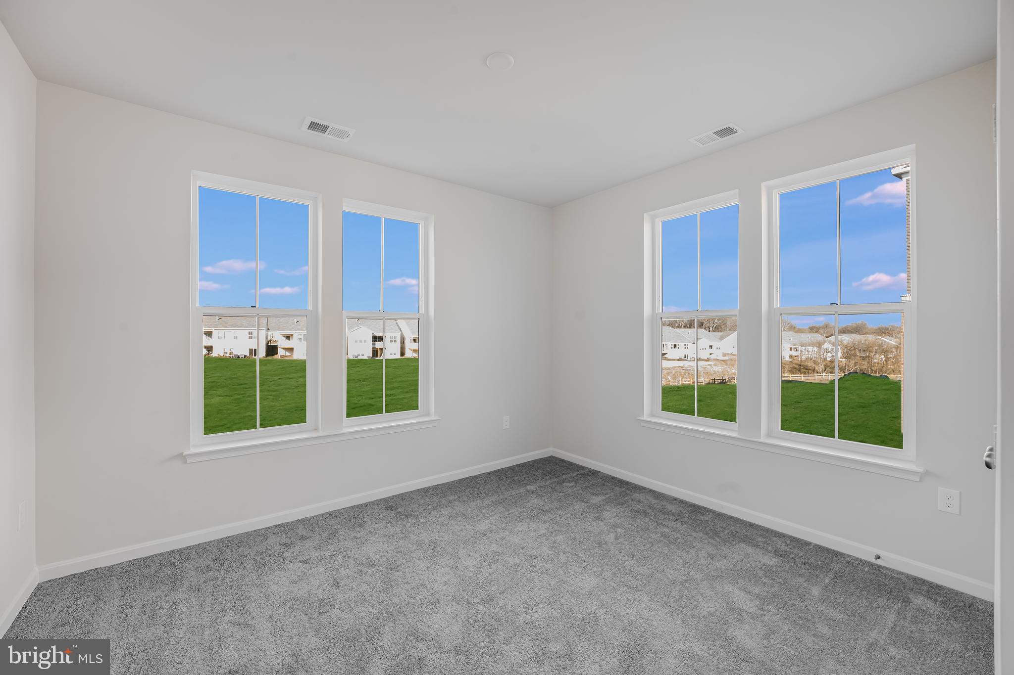 4003 Seaside Alder Road, Unit 206 LILY Bowie, MD 20720 - Photo 12 of 20 an empty room with windows