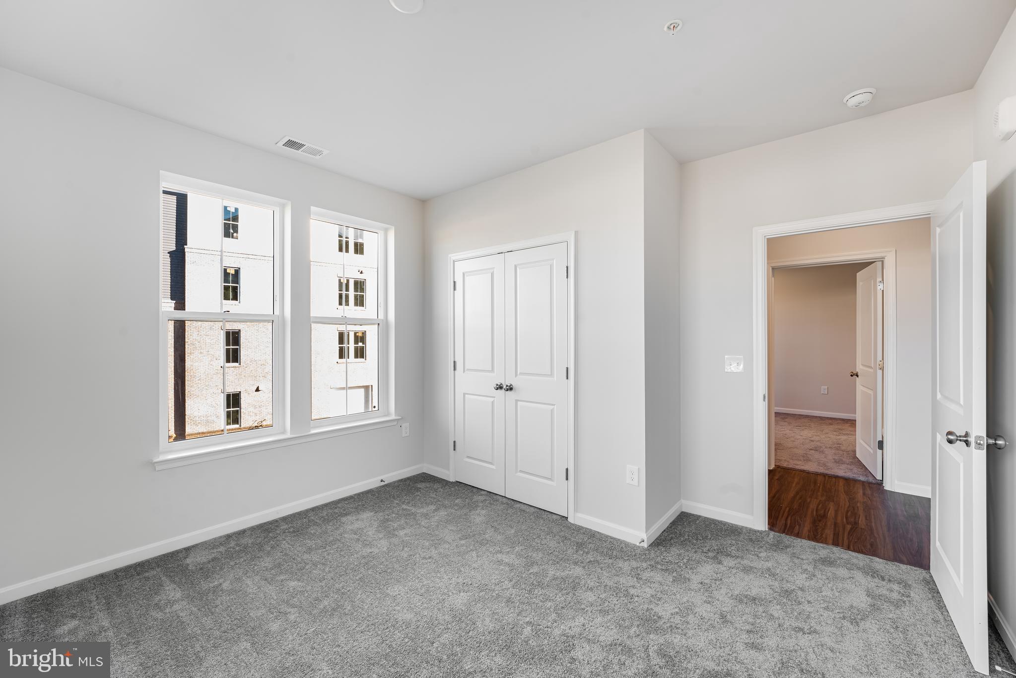 4003 Seaside Alder Road, Unit 206 LILY Bowie, MD 20720 - Photo 13 of 20 an empty room with windows and closet