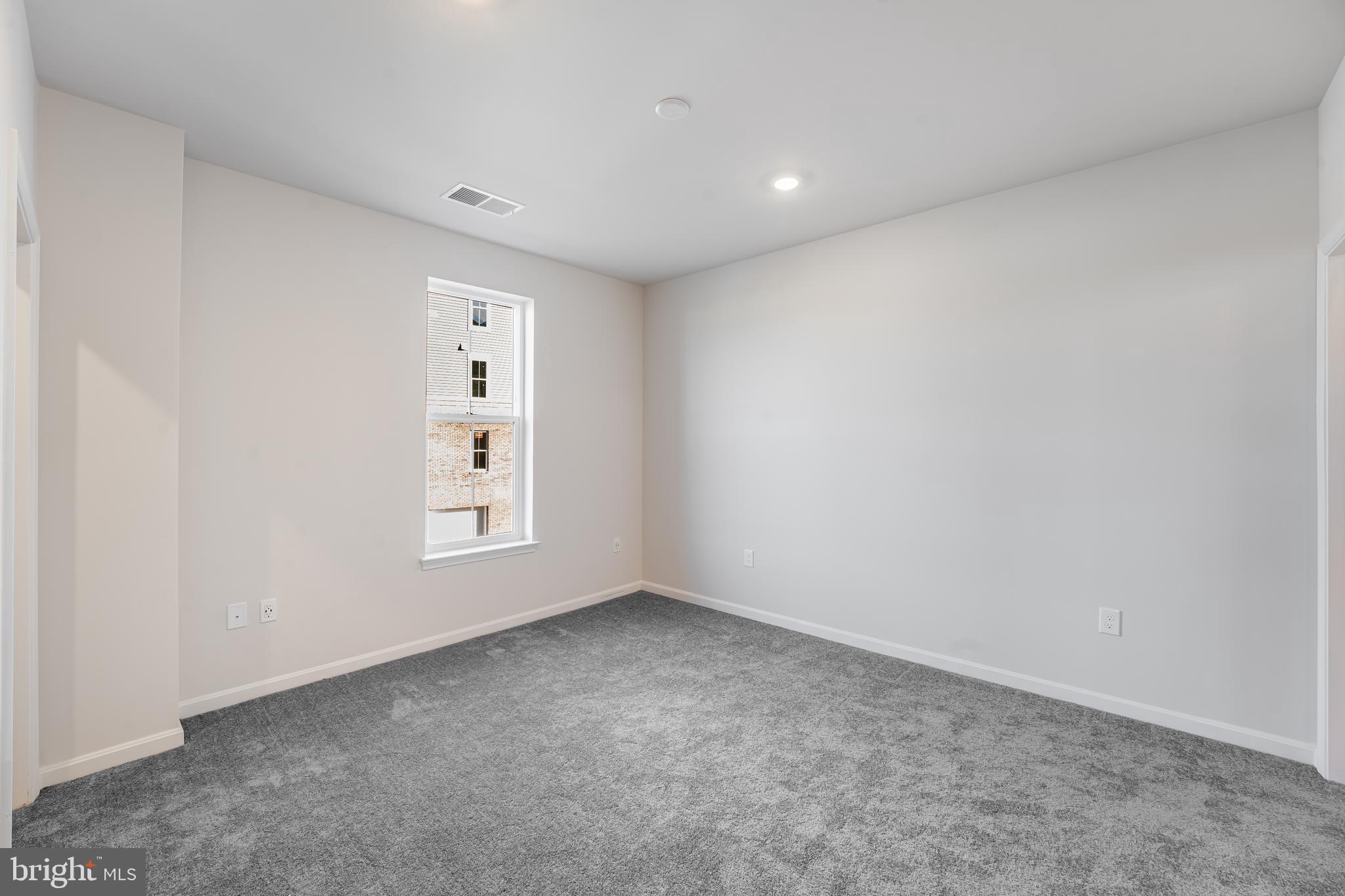 4003 Seaside Alder Road, Unit 206 LILY Bowie, MD 20720 - Photo 14 of 20 a view of an empty room with a window
