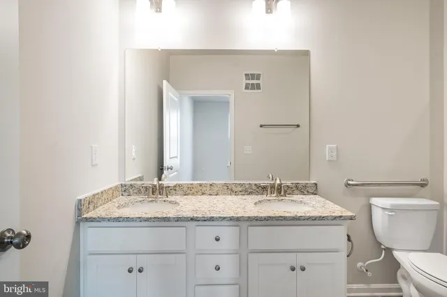 a bathroom with a shower and a toilet