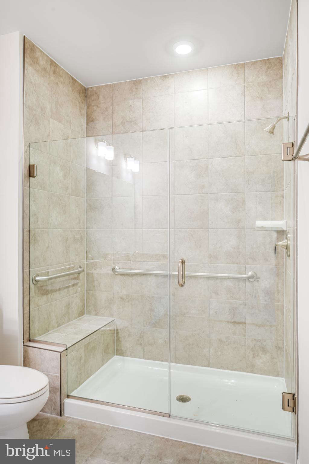 4003 Seaside Alder Road, Unit 206 LILY Bowie, MD 20720 - Photo 19 of 20 a bathroom with a shower and a toilet