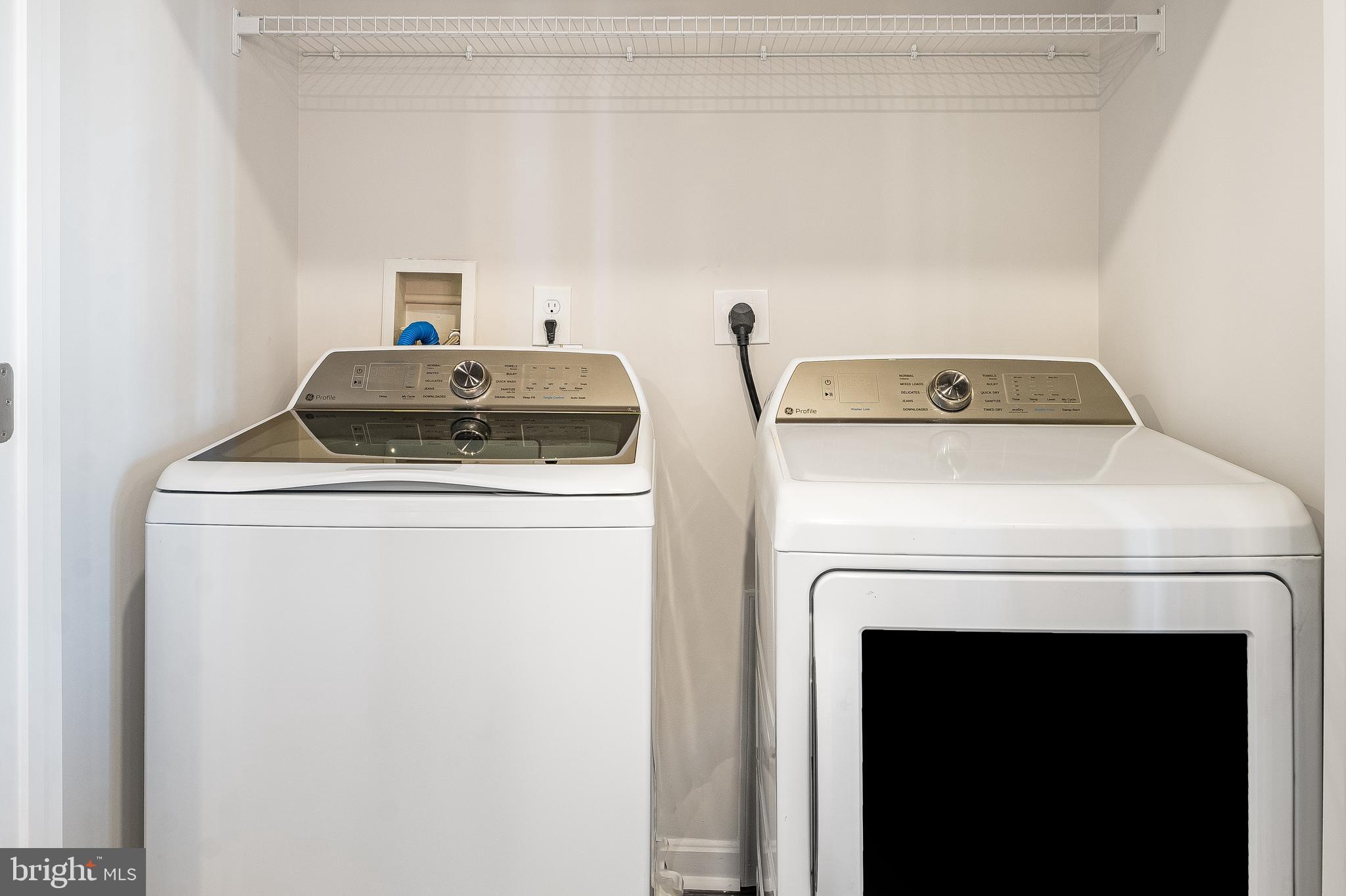 4003 Seaside Alder Road, Unit 206 LILY Bowie, MD 20720 - Photo 7 of 20 a utility room with dryer and washer