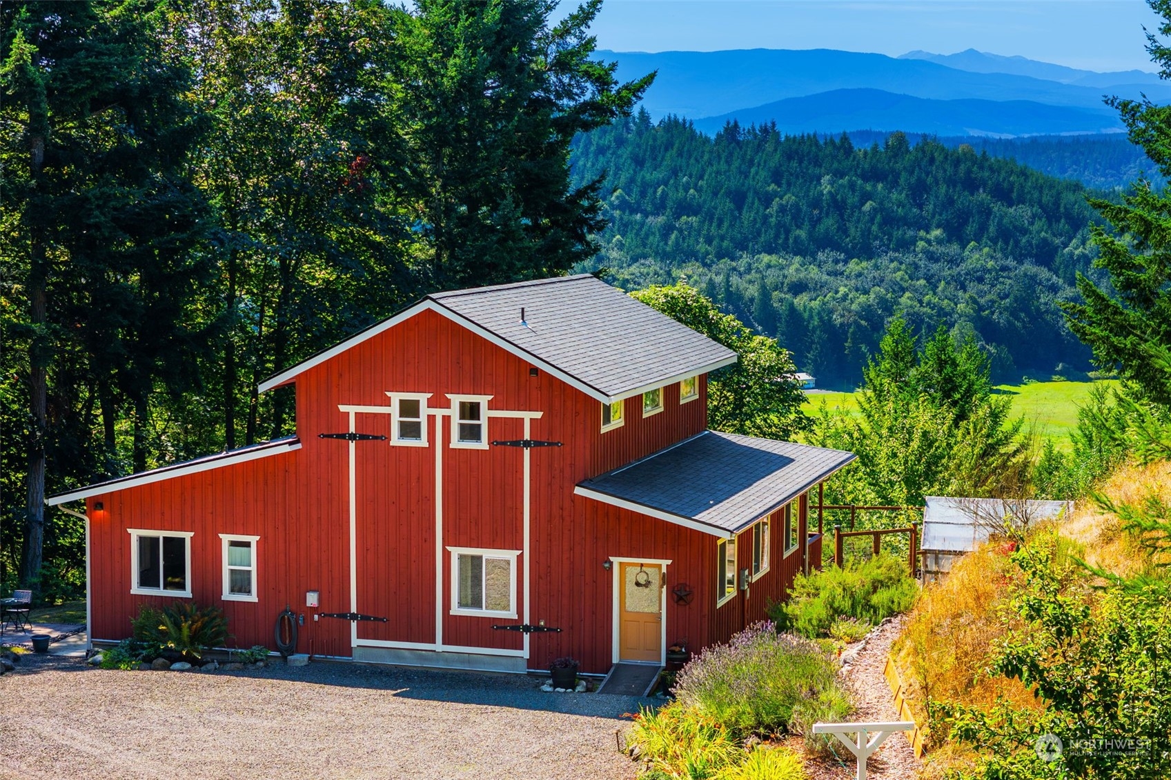 702 Sugar Hill Road Port Hadlock, WA 98339 - Photo 1 of 40 a front view of a house with a yard