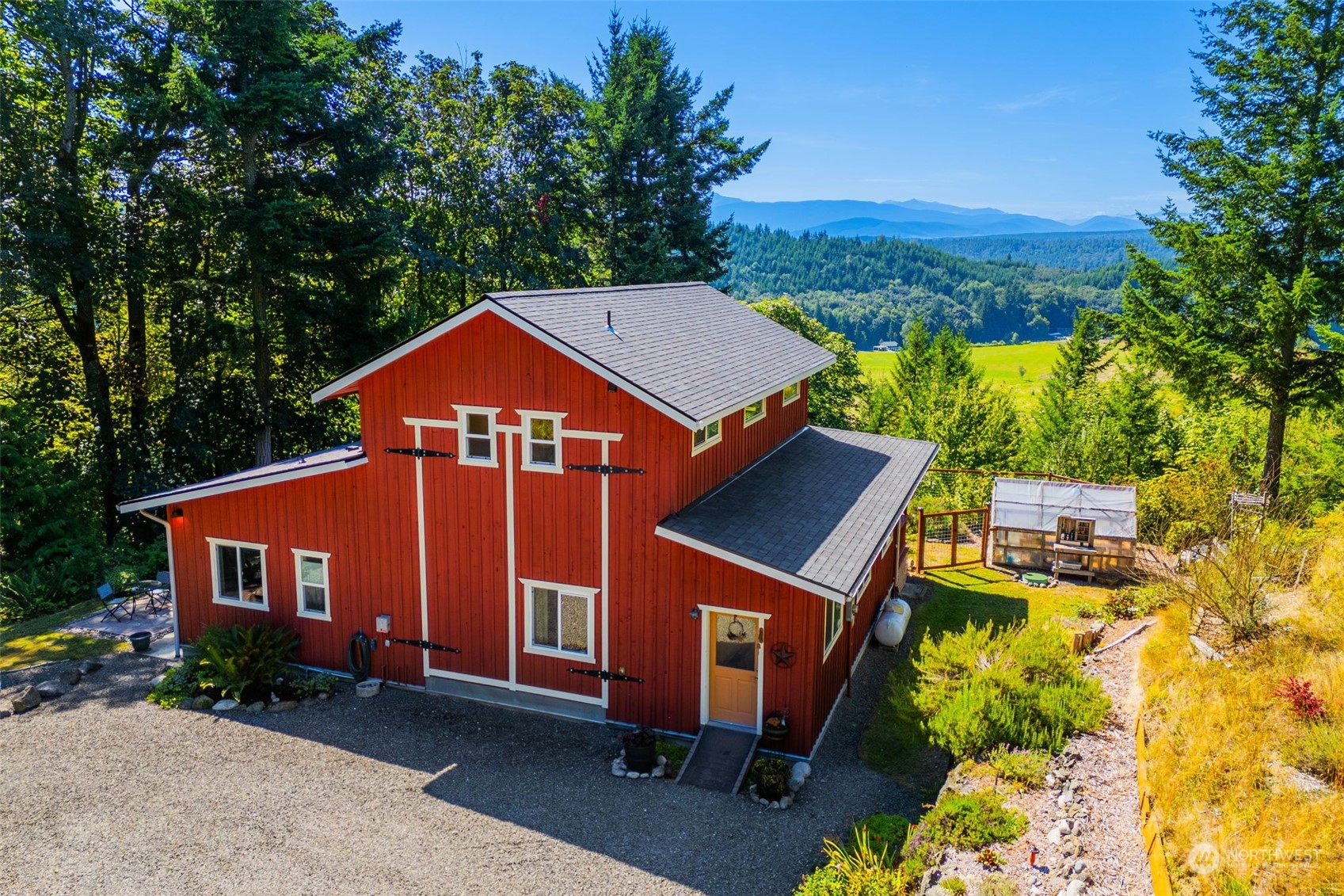 702 Sugar Hill Road Port Hadlock, WA 98339 - Photo 2 of 40 a front view of a house with a yard and large trees