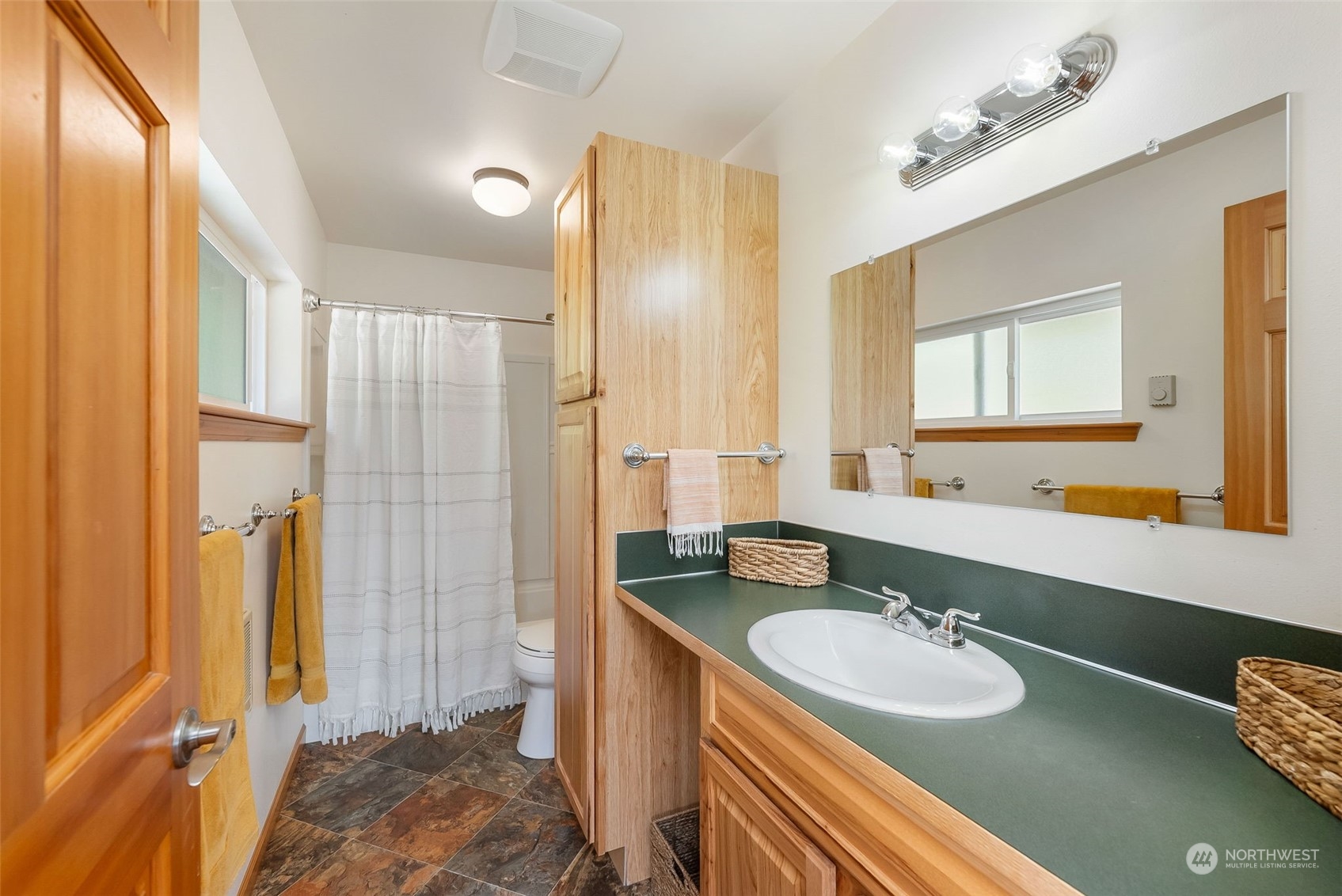 702 Sugar Hill Road Port Hadlock, WA 98339 - Photo 26 of 40 a bathroom with a granite countertop sink and a mirror